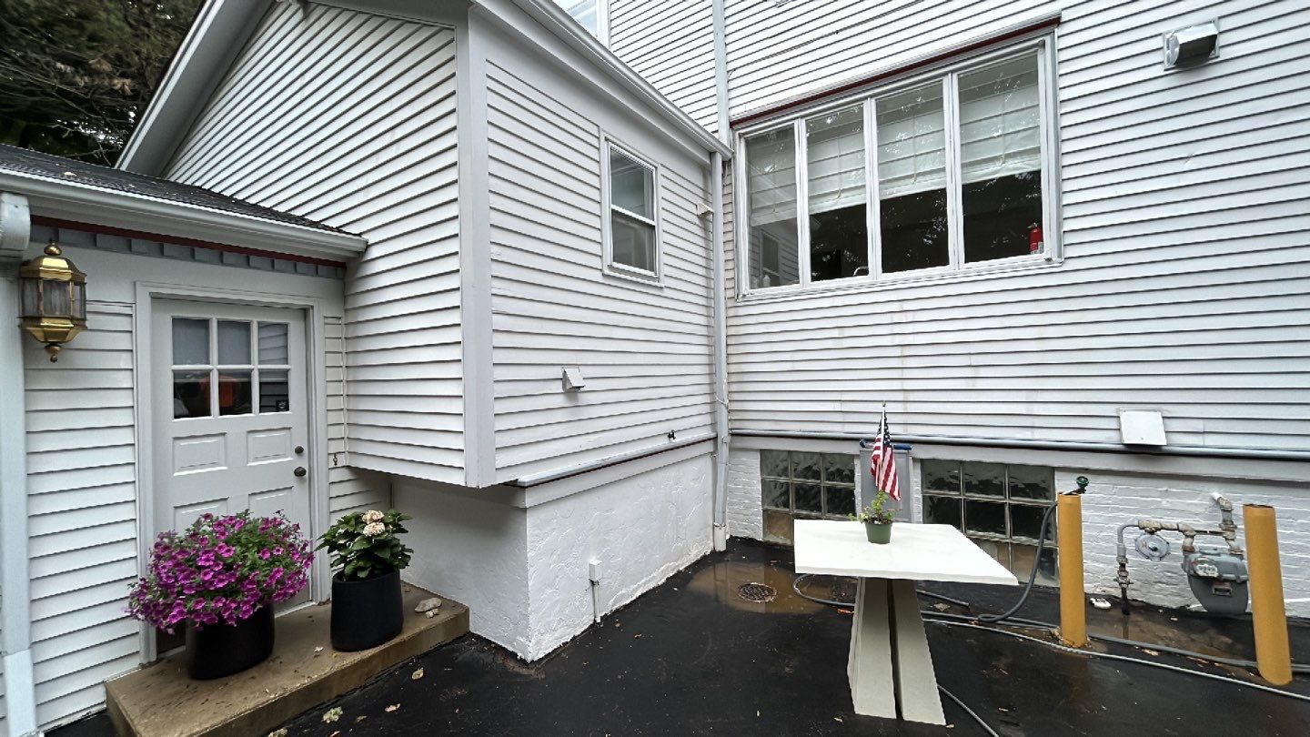 Housewashing  using Algaecide, soft wash soap by Northern Power Washing LLC.
