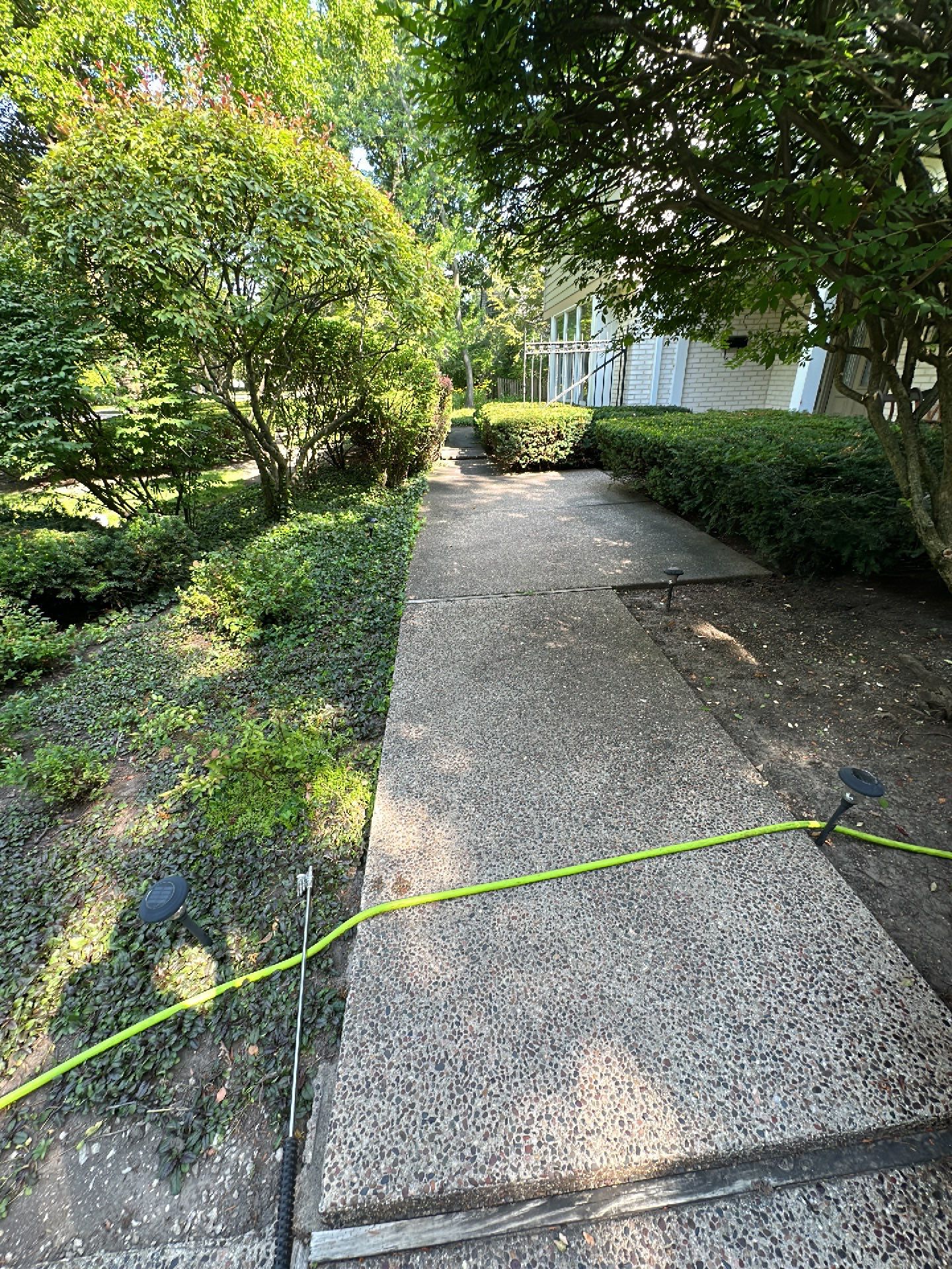 Aggregate concrete cleaning and sealing using Surebond SB-9000 by Northern Power Washing LLC.