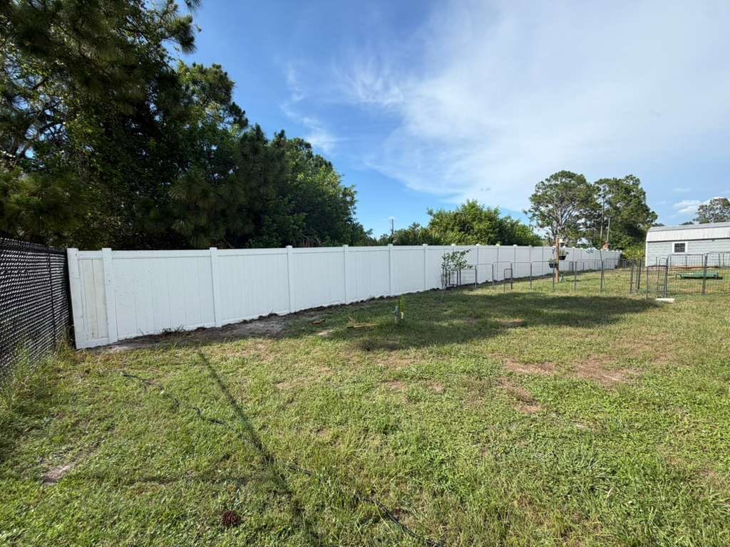 Black Chain Link and Vinyl Privacy Fence Installation in North Port by True Fence LLC