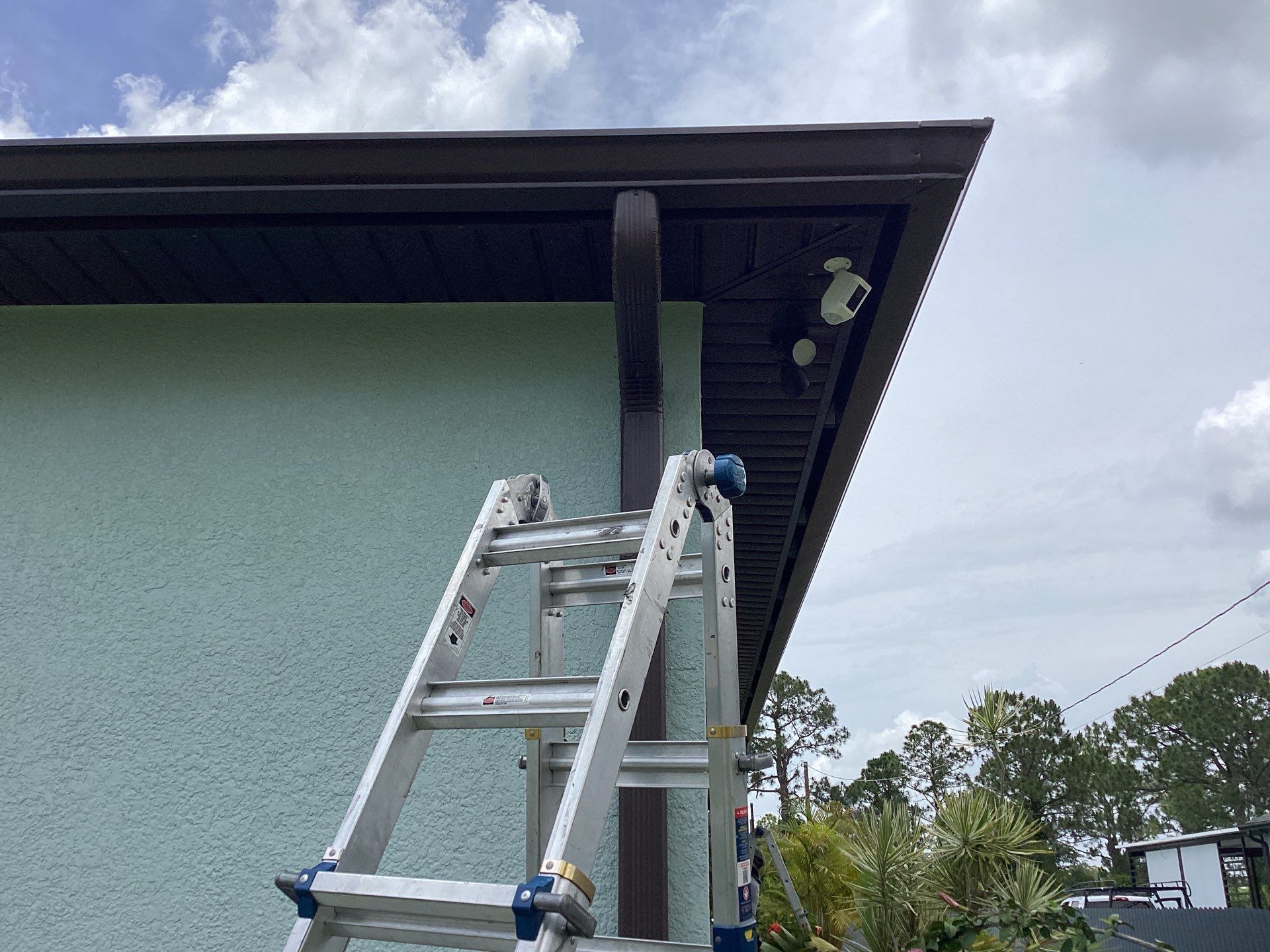 Musket Brown and New Downspouts in Lehigh Acres, FL  by Gutter Professors