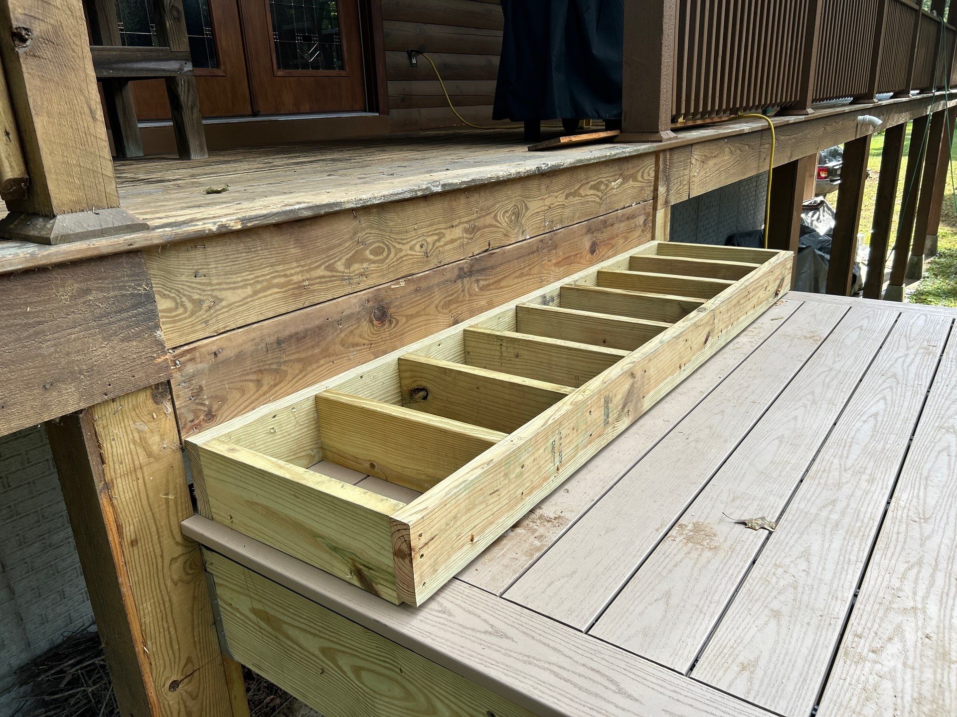 Log Cabin Wrap-Around Deck and External Staircase Installation in Caldwell by Walnut Hollow Decks & Outdoor Living