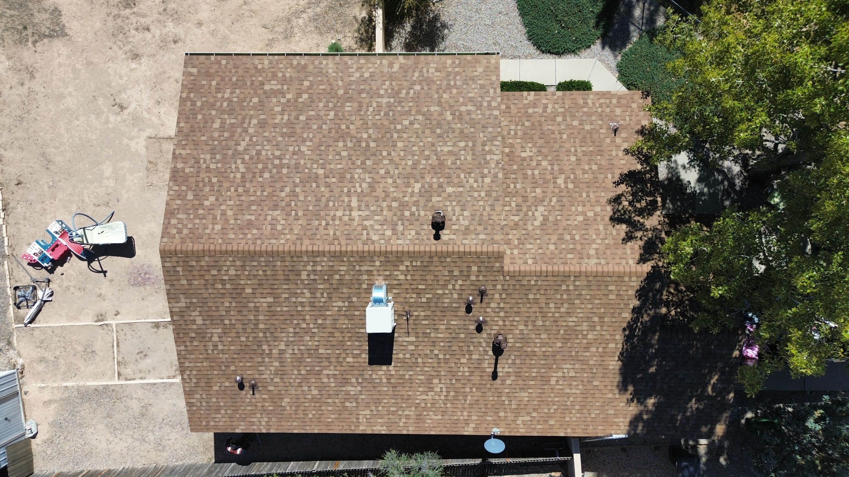 Oakridge Desert tan shingles in Chimayo Meadows by Doyle Roof Masters Inc