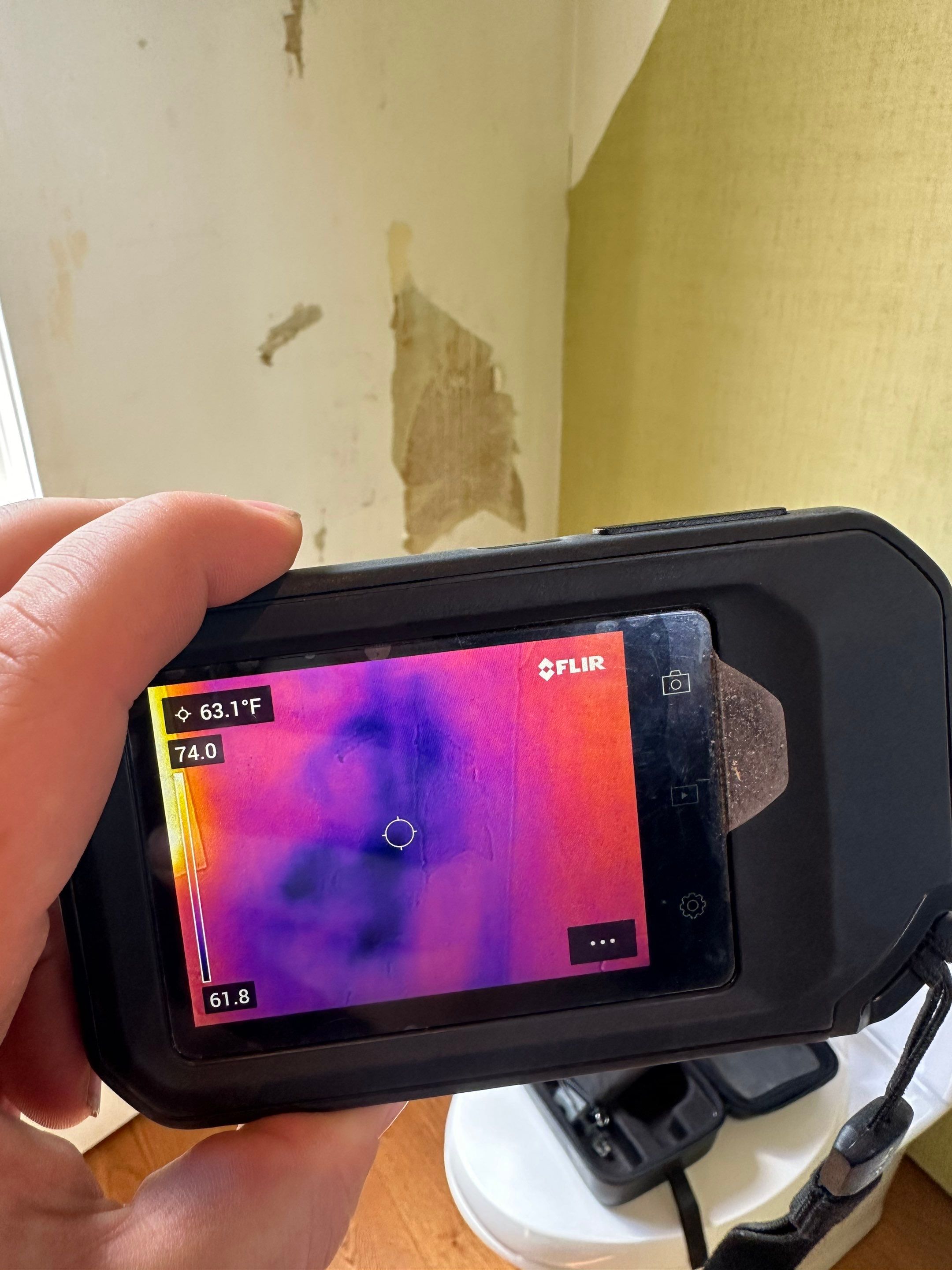 Water saturated exterior wall in half bathroom by BlueRed Restoration