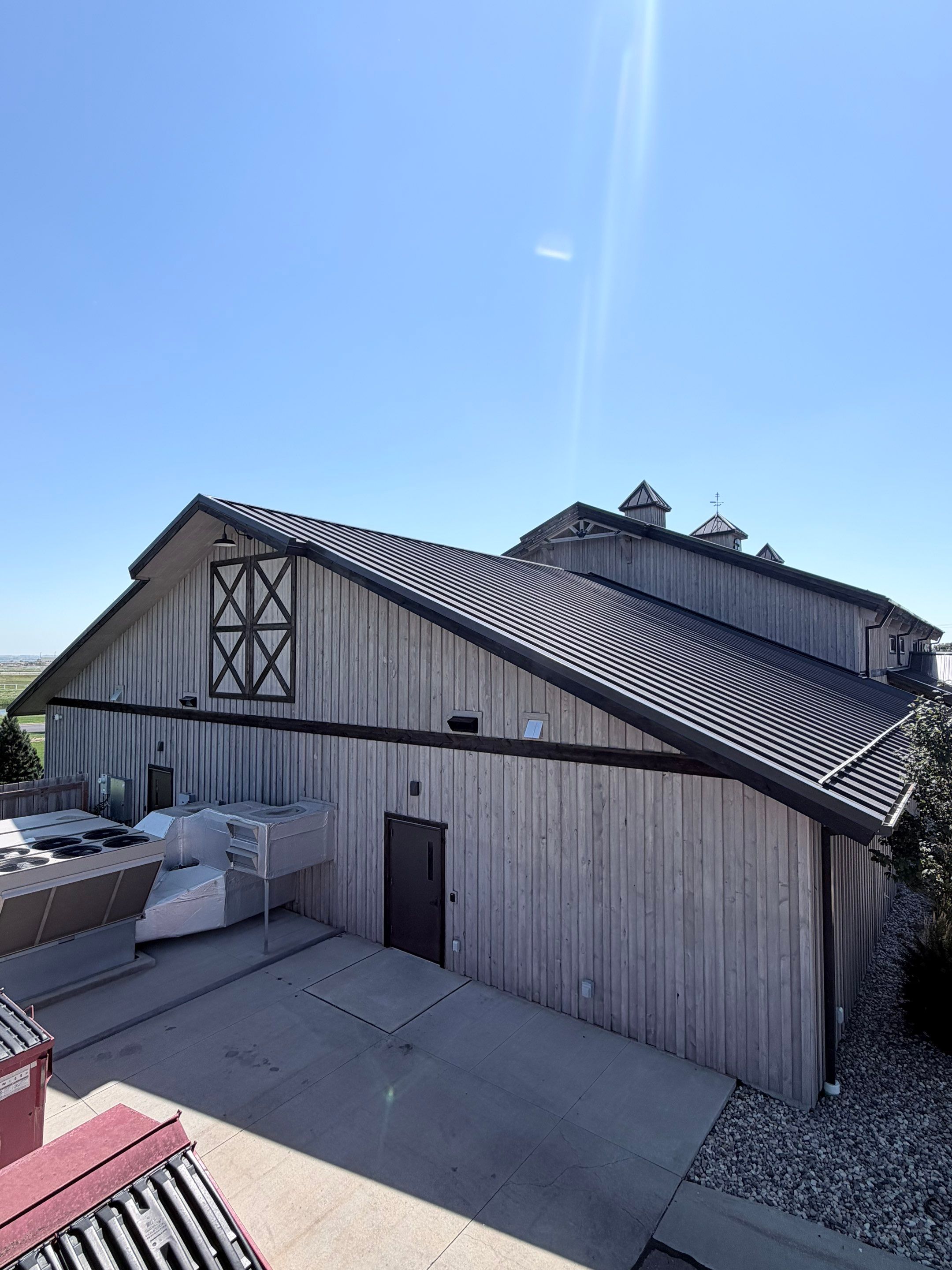 Commercial Exterior Wood Staining for Sanford Barn in Sioux Falls by Select Painting, Coatings & Garage Cabinets