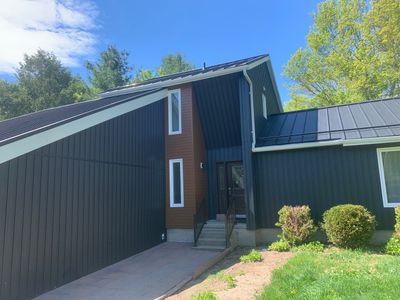 Residential Roofing Installation using 16" Standing Seam Panels