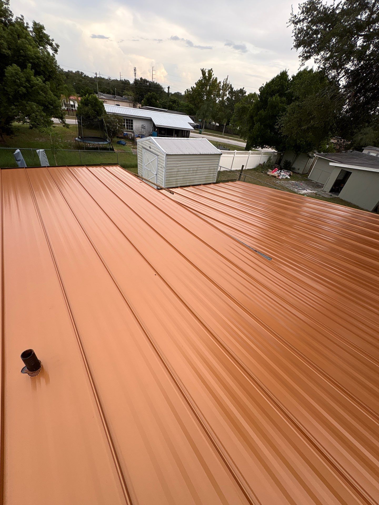 Standing Seam Metallic Copper Metal Roof Replacement in Deltona by Pinnacle Roofing Group