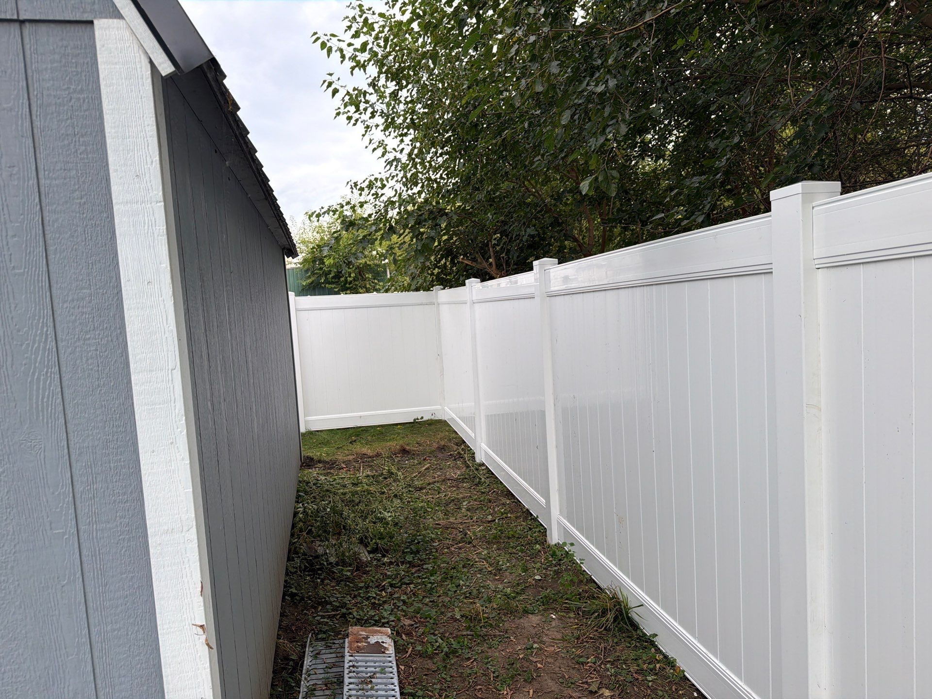 White Vinyl Privacy Fence Installation in Raymond, IA by Perfect Picket Fence and Stain