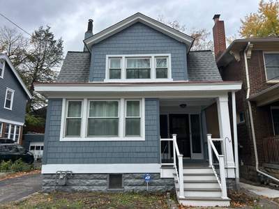 Full House Siding Renovation with Blue Shake Siding in Pittsburgh