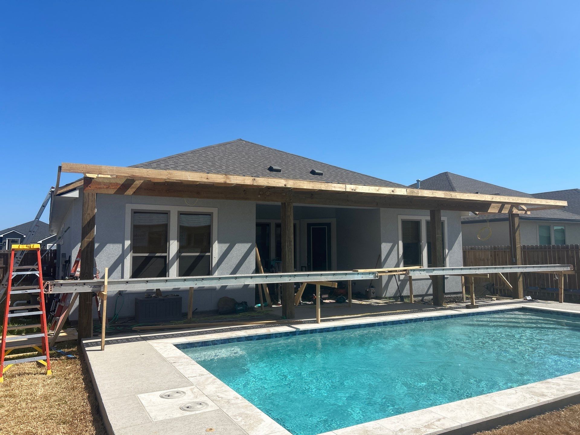 Patio Pool Cover by Bayfront Roofing and Construction