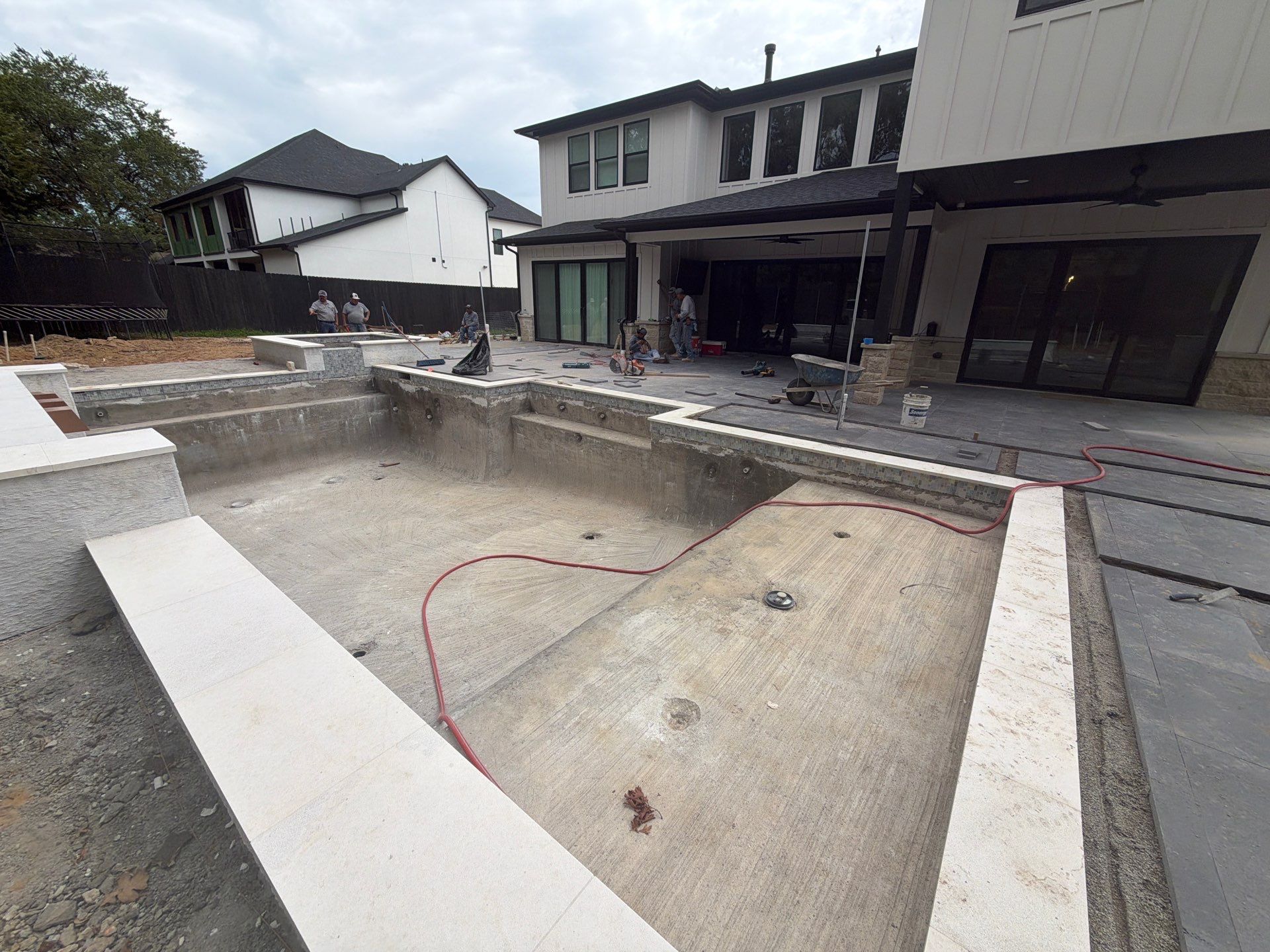 Modern Geometric Pool with Raised Spa and Sheer Descents by Pinnacle Pools and Spas - DFW