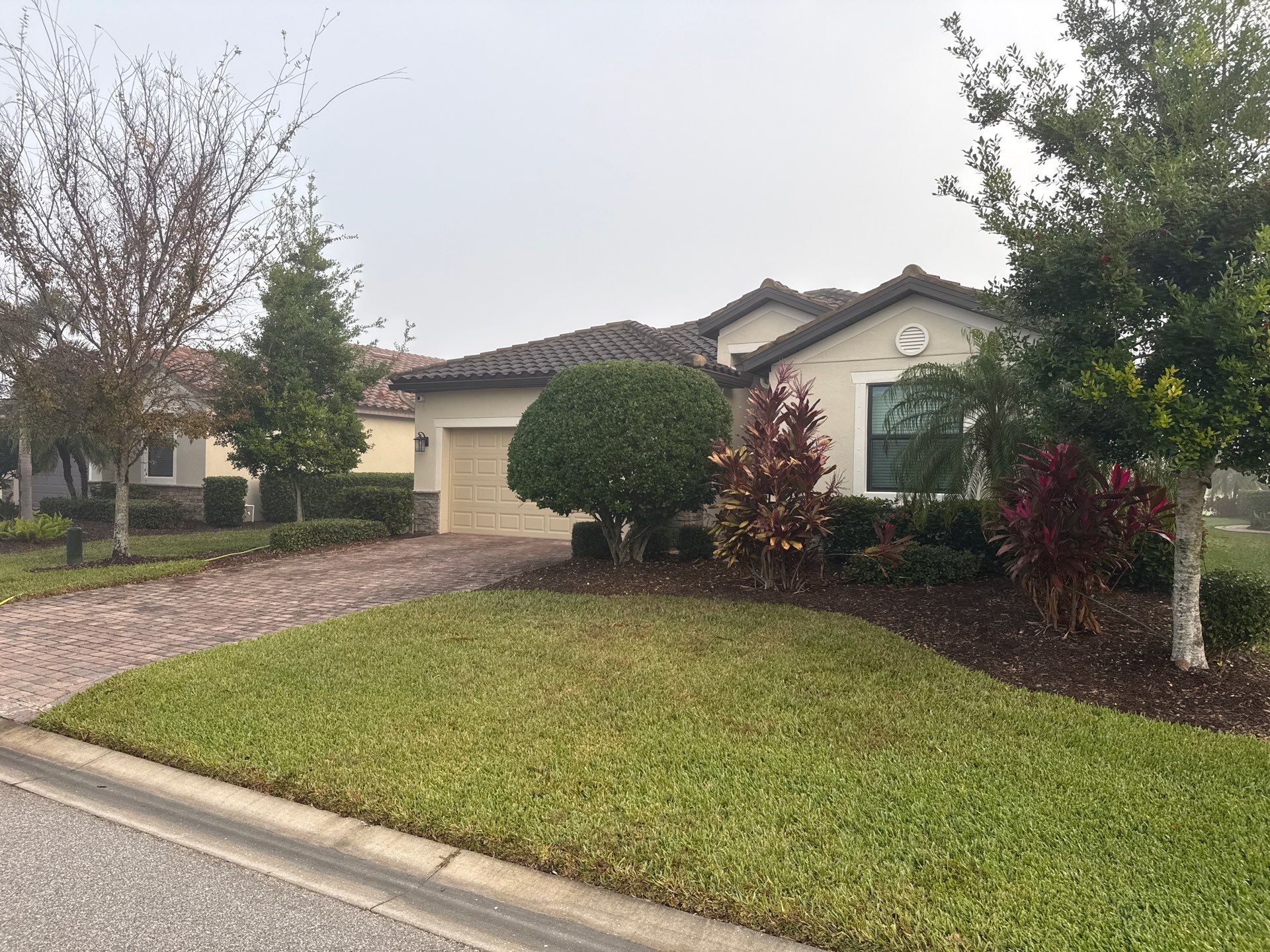 Barrel Tile Roof Cleaning & Paver Driveway Cleaning in River Strand at Heritage Harbour | Bradenton, FL by Sunshine AquaWash