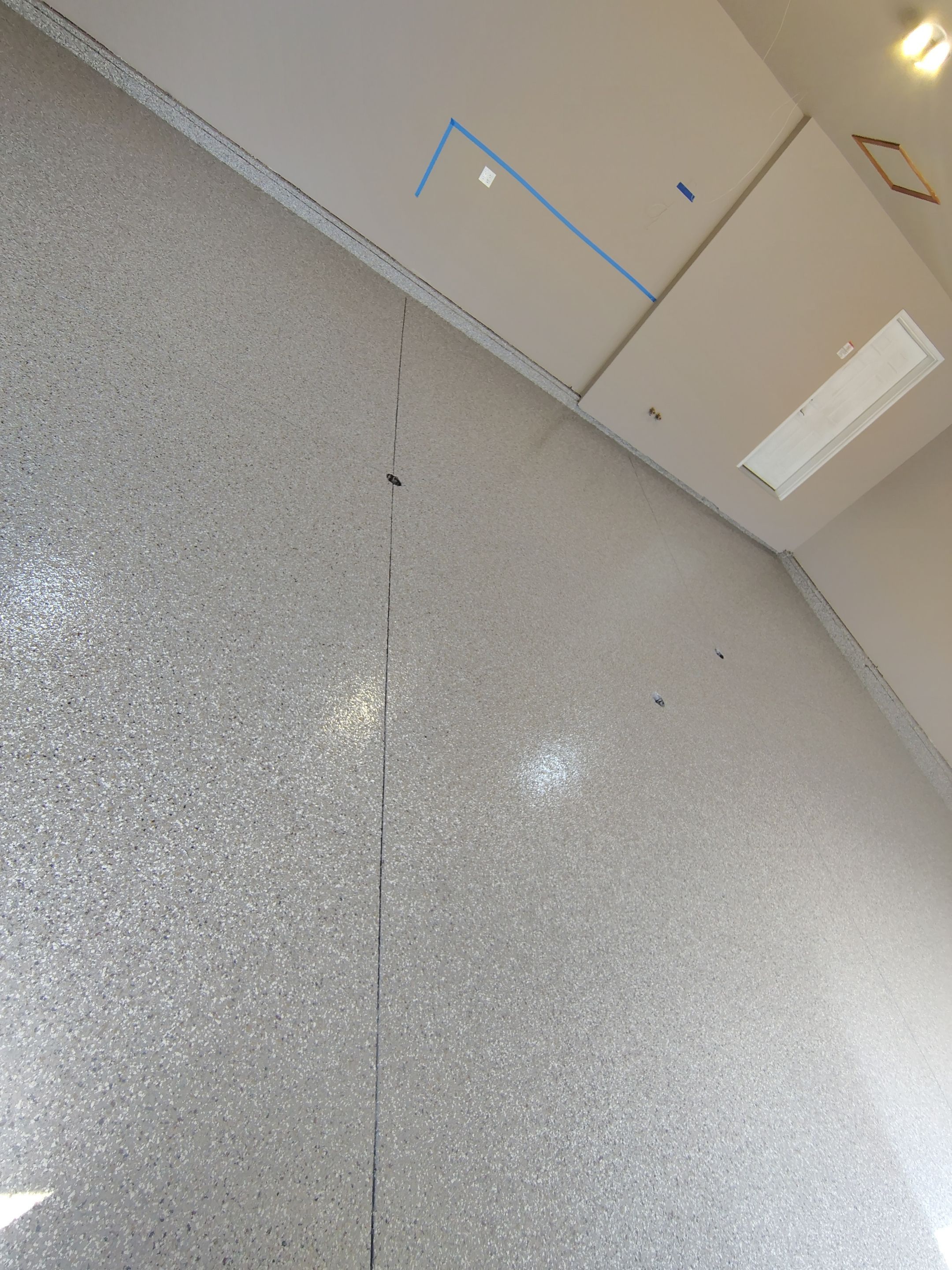 Sioux Falls Garage Concrete Repair and Epoxy Flake Floor Coating by Select Painting, Coatings & Garage Cabinets