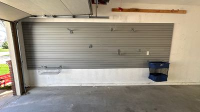 Melissa L. upgraded her garage with slatwall and overhead racks