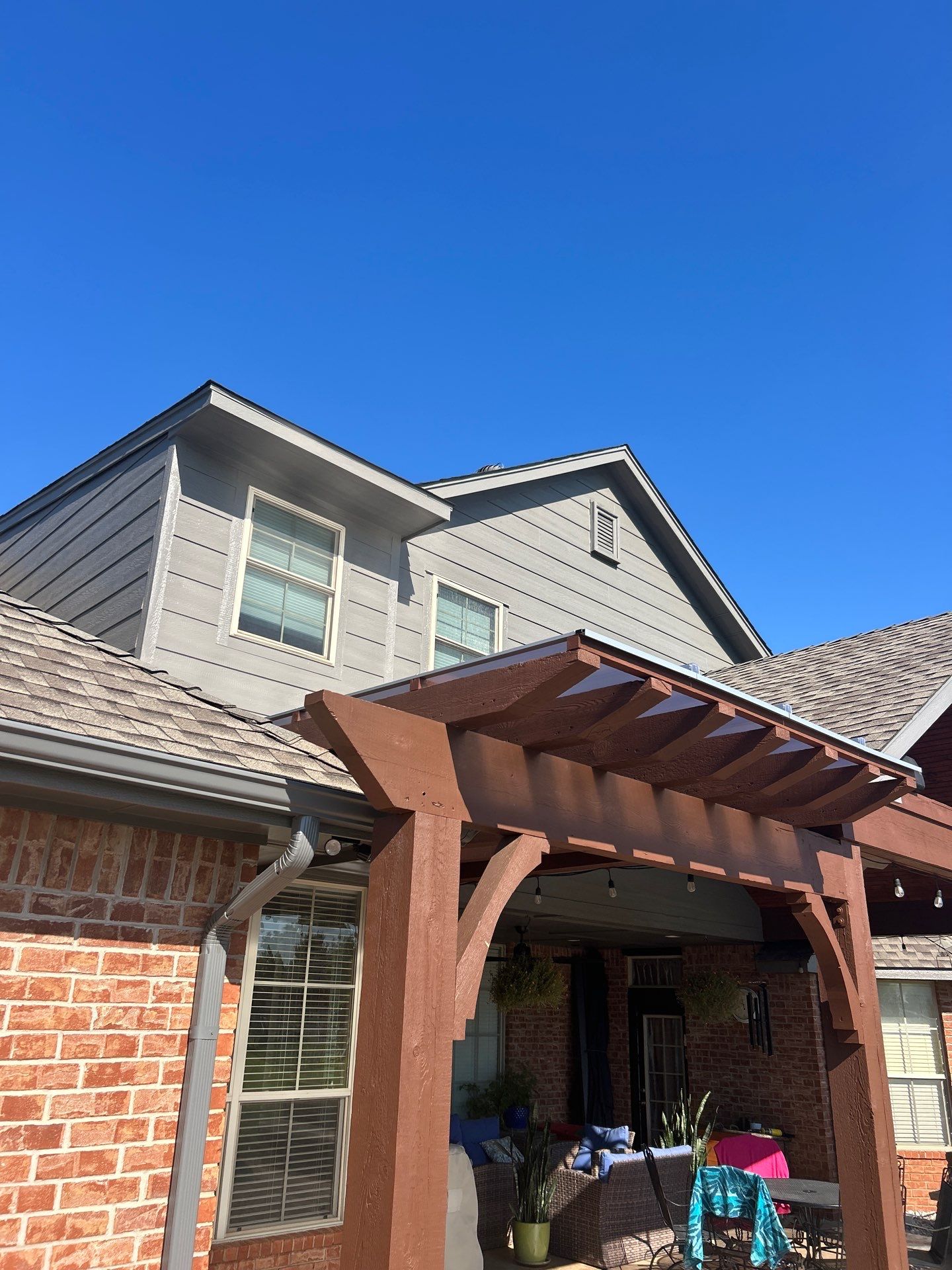 Siding Replacement and Exterior Painting and Pergola Cover Install in Edmond, OK by McCann's Roofing and Construction