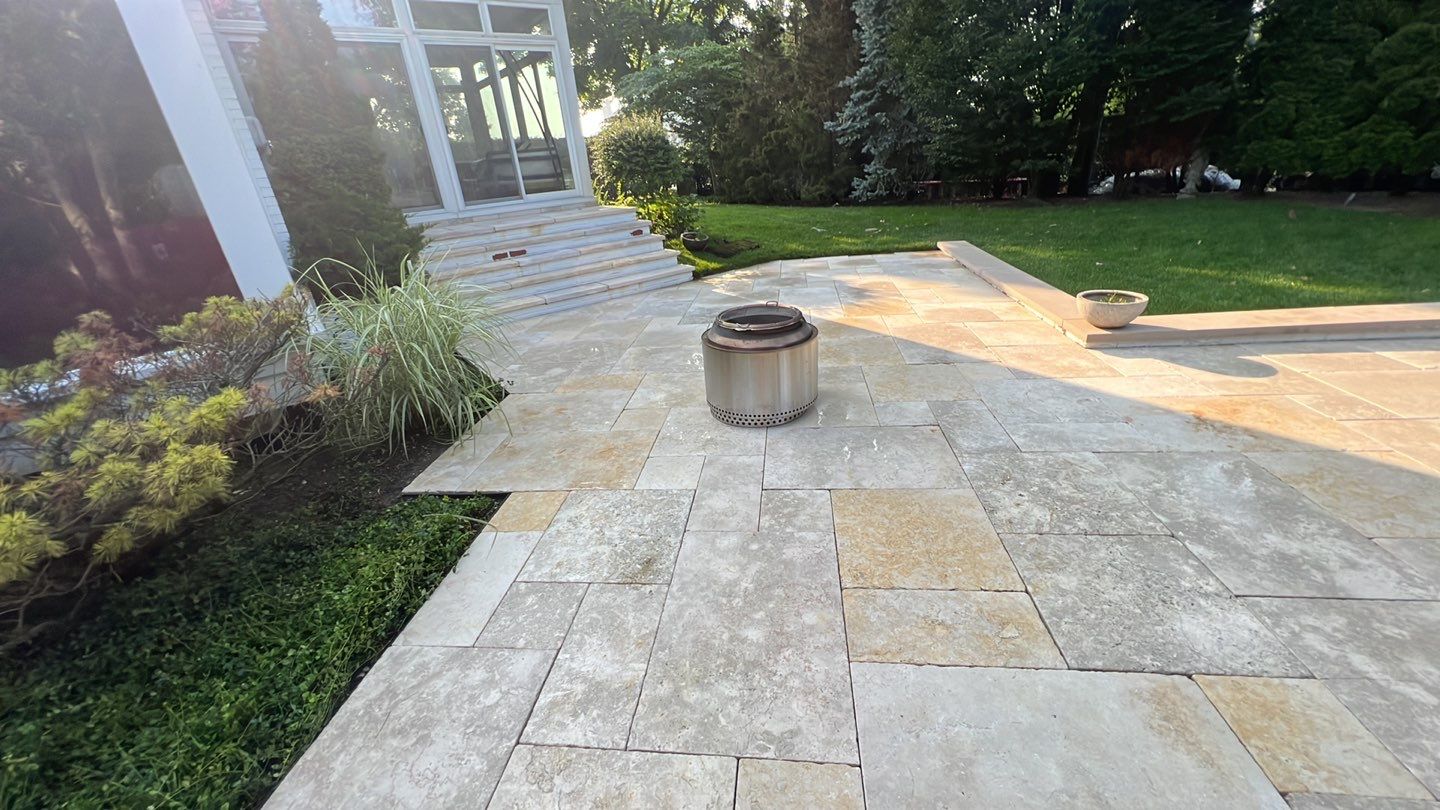 marble patio cleaning and sanding using Polysweep polymeric sand by Northern Power Washing LLC.