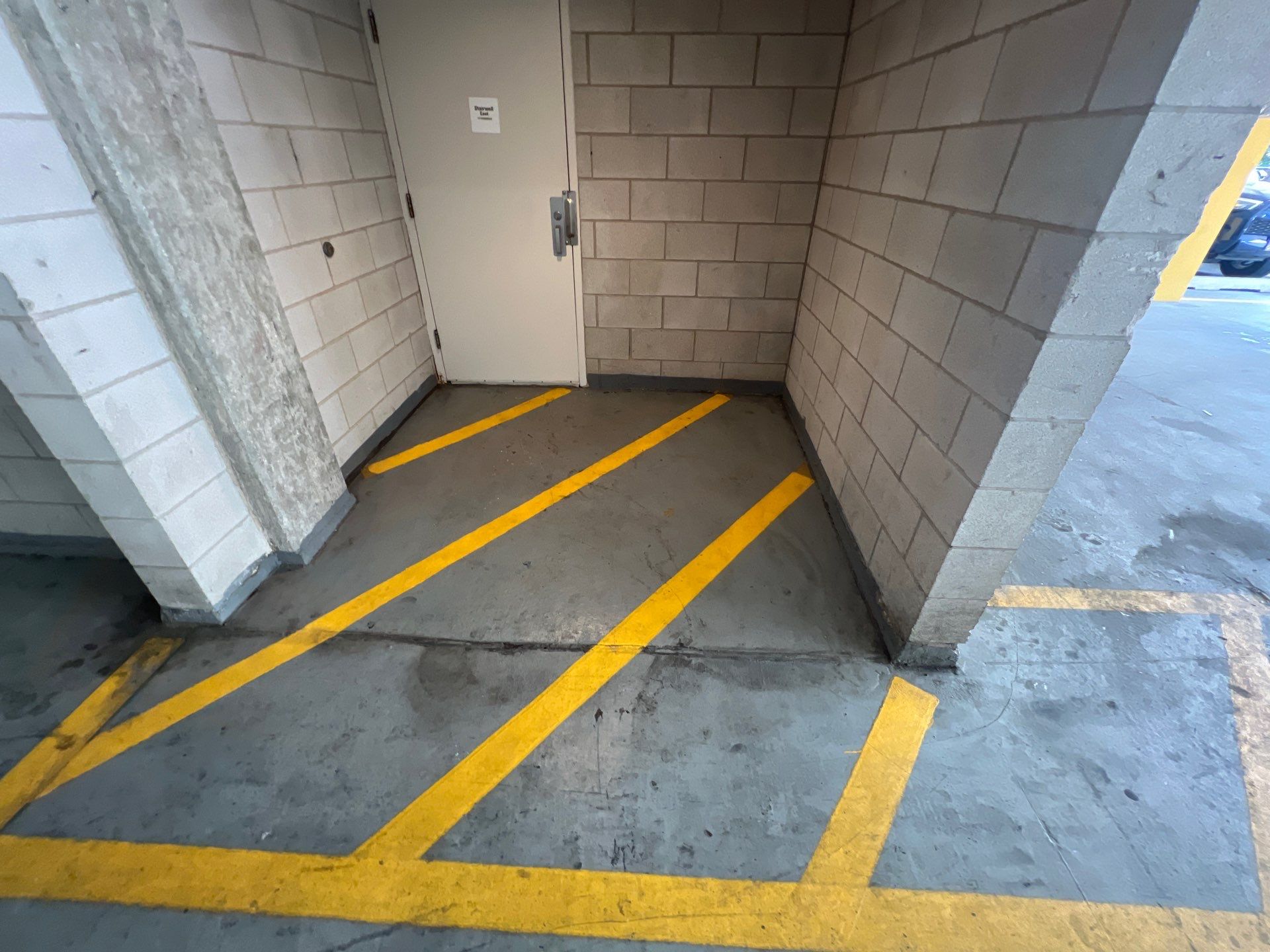 Parking garage using Hot water by Northern Power Washing LLC.