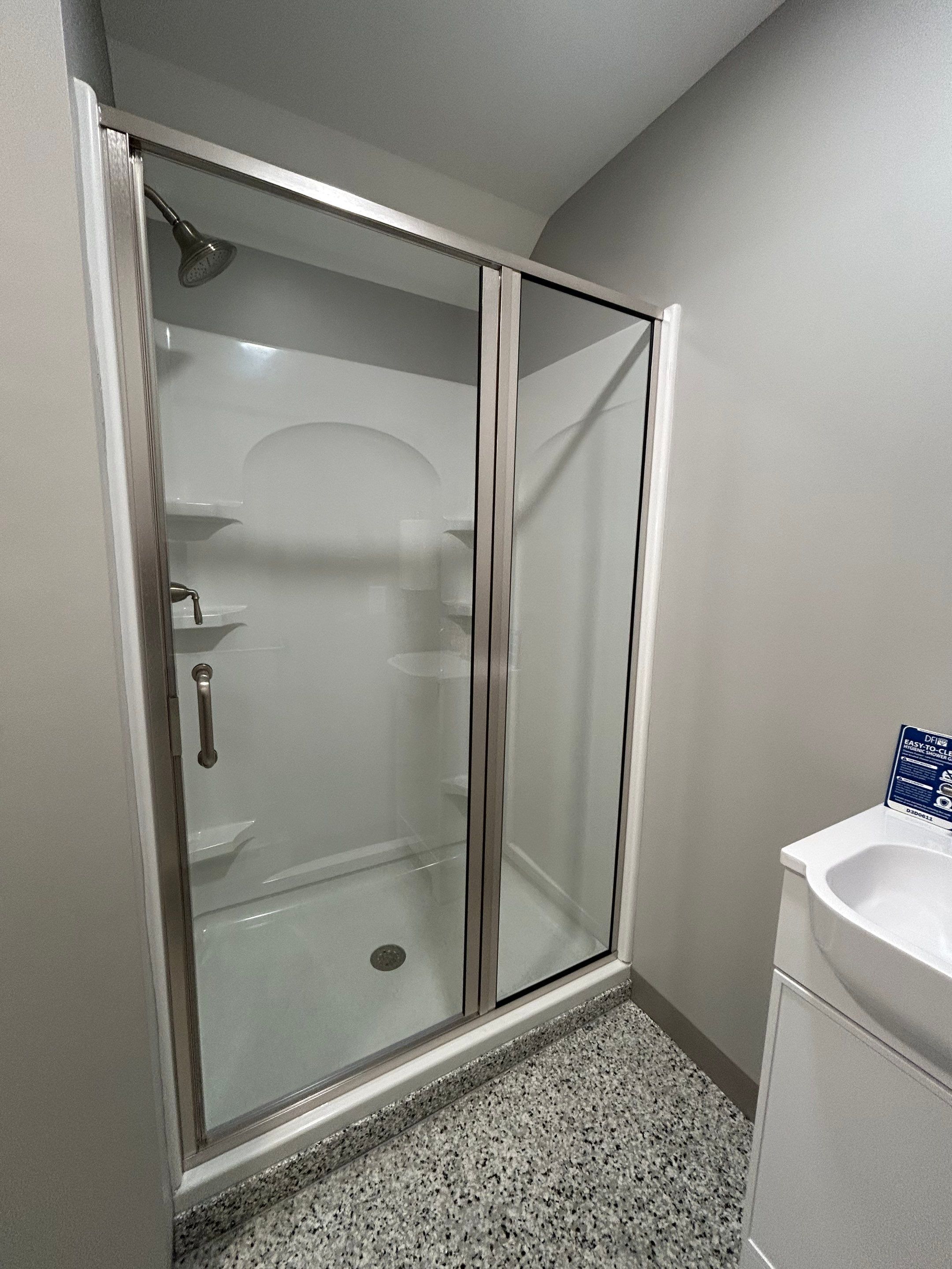 Two Showers using Alumax Shower by Cheshire Glass Company