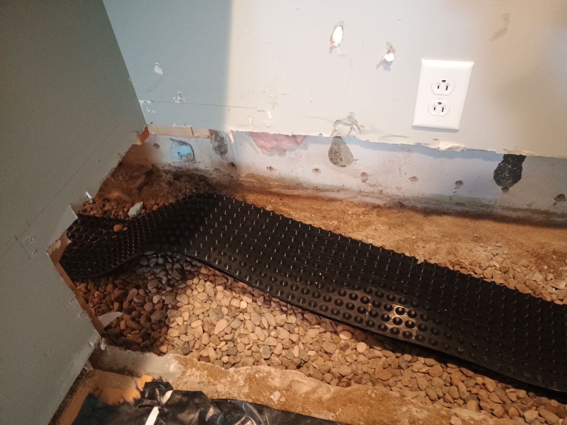 Interior Drain Tile in a Finished South Minneapolis Basement by Waterproofing Northeast