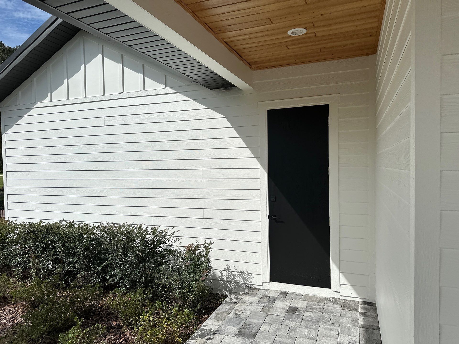 Complete Two-Story House Wash and Driveway Cleaning in Winding River Community, Bradenton, FL by Sunshine AquaWash