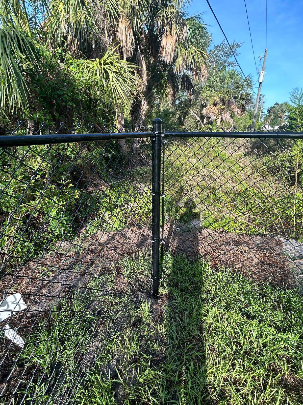 Residential Black Vinyl-Coated Chain Link Fence in Port Charlotte by True Fence LLC