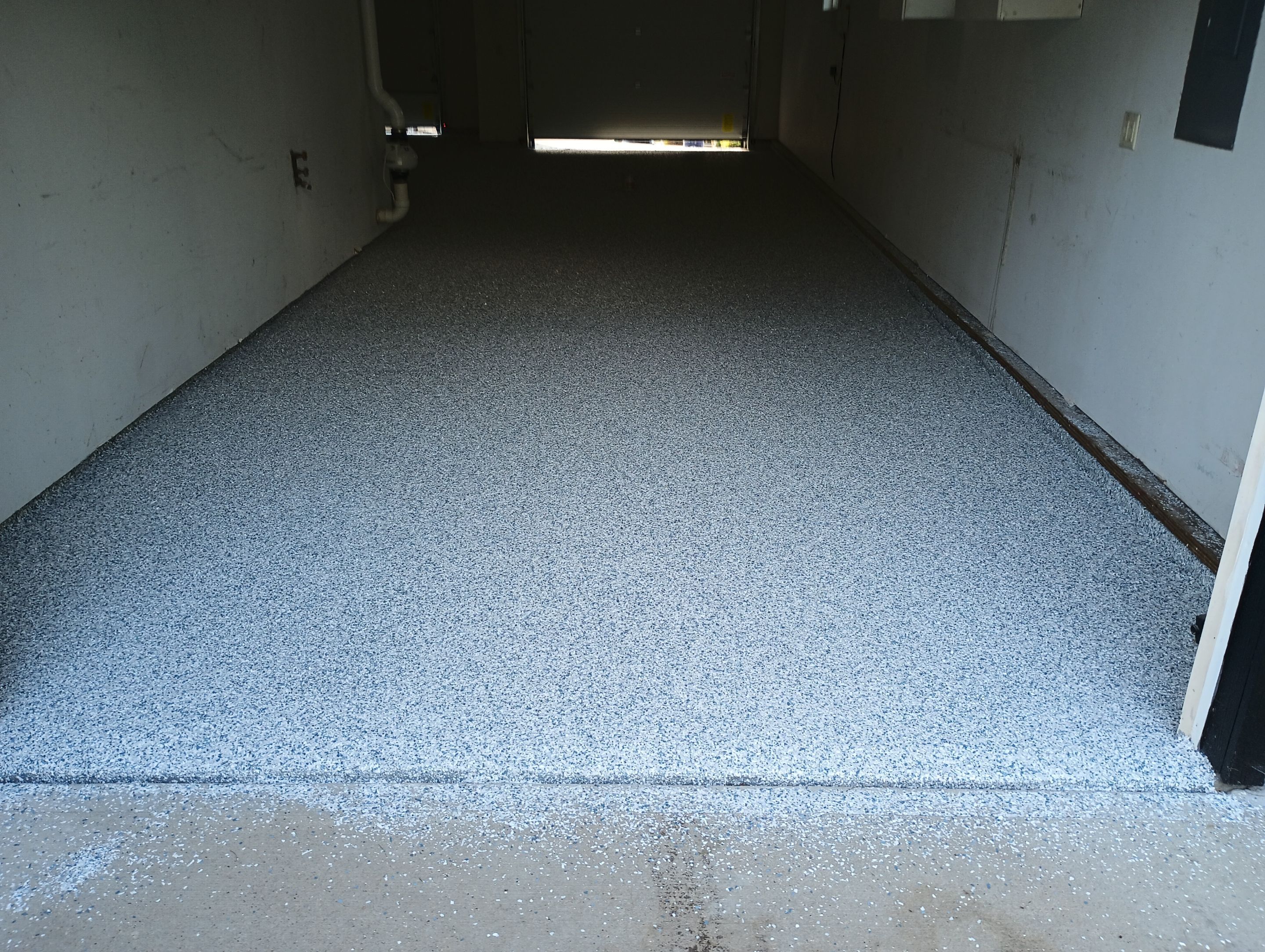 Garage Concrete Coating Installation in Sioux Falls Using Tidal Wave Finish by Select Painting, Coatings & Garage Cabinets