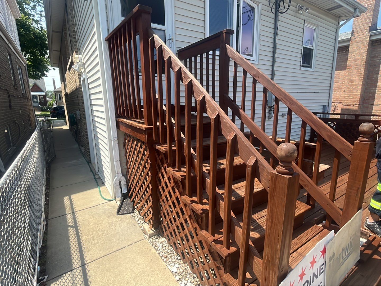 Wood cleaning and staining using Armstrong cloark oil stain by Northern Power Washing LLC.