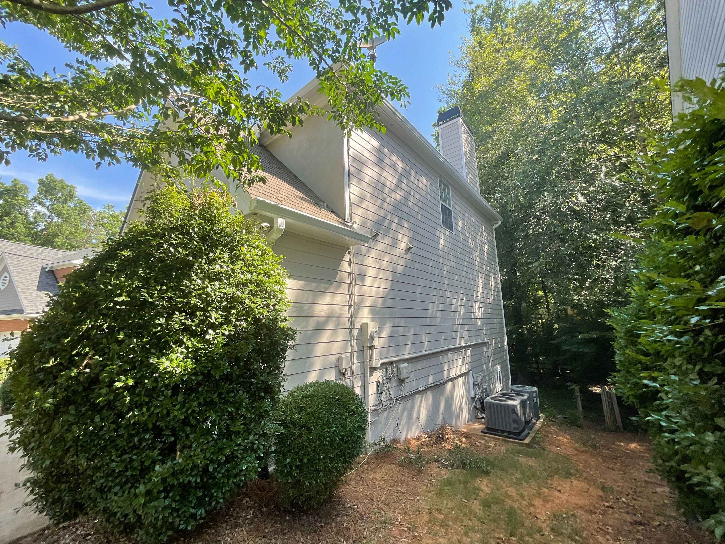 Stucco and Siding Exterior Painting with New Gutters in Kennesaw by Swift Home Renovations