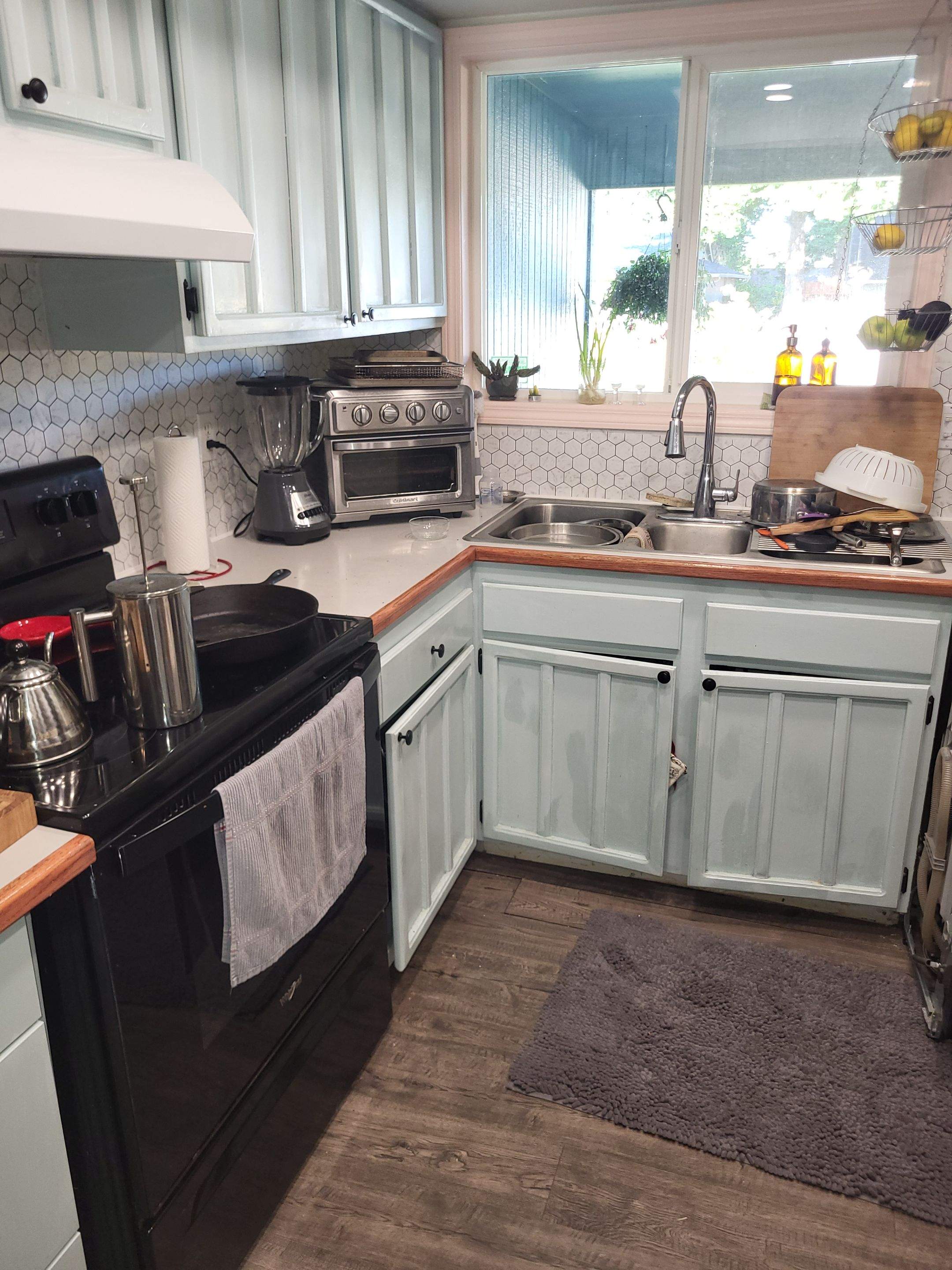 Vancouver Kitchen Renovation Featuring Tile Backsplash and Farmhouse Sink by American Made Construction 