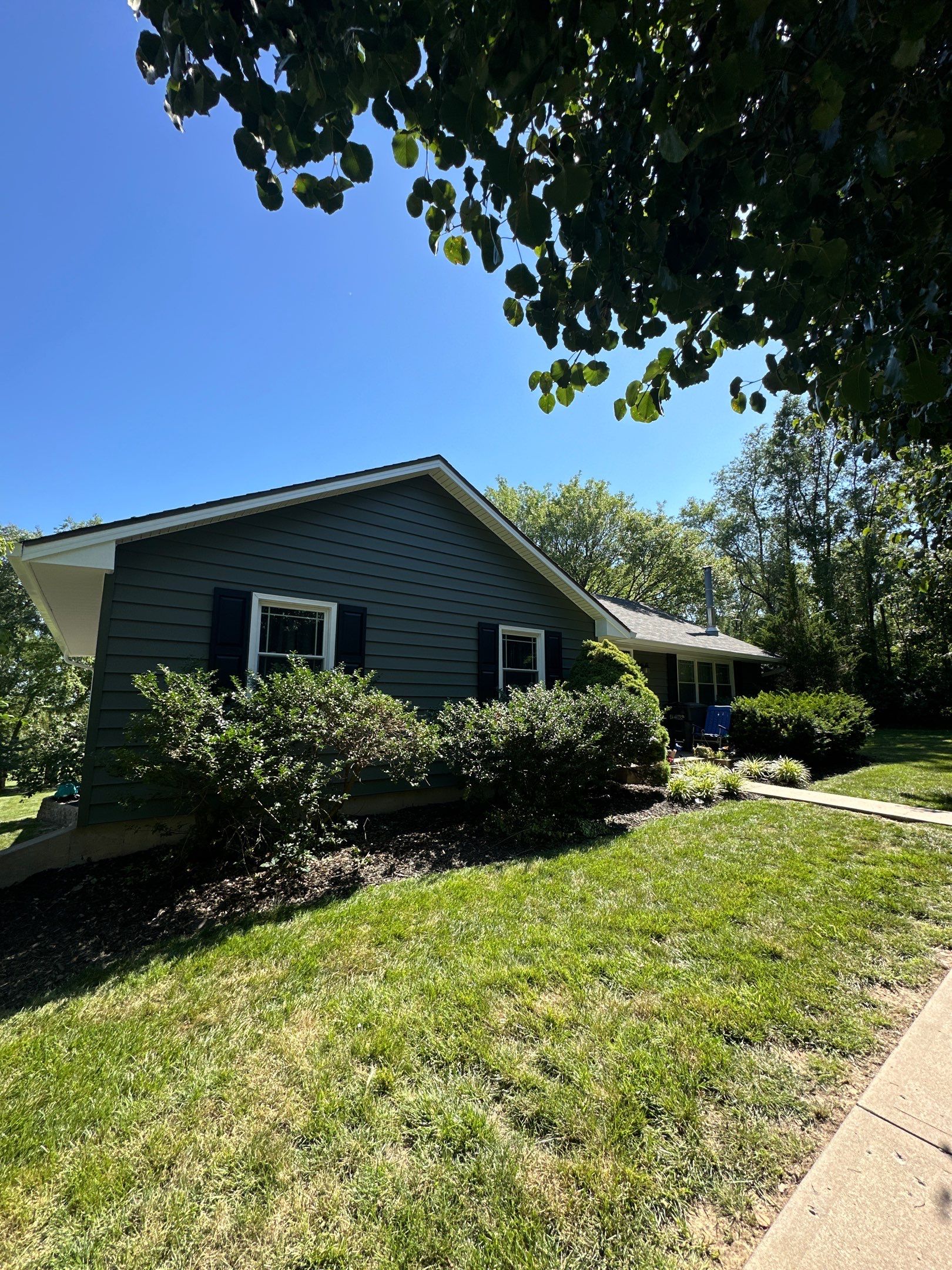 New Craneboard Siding on this Platte City, Mo home  by EEC  Windows, Siding & Roofing 