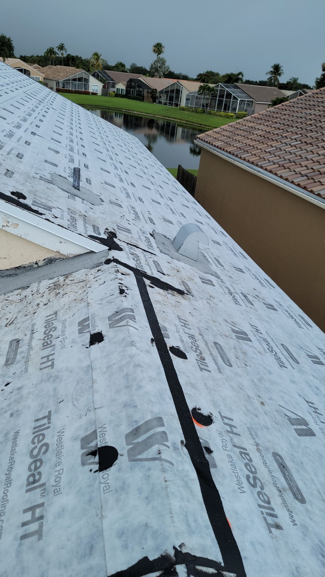 New Barrel Tile Roof Installation and Decking Repair in Boynton Beach by Aastro Roofing
