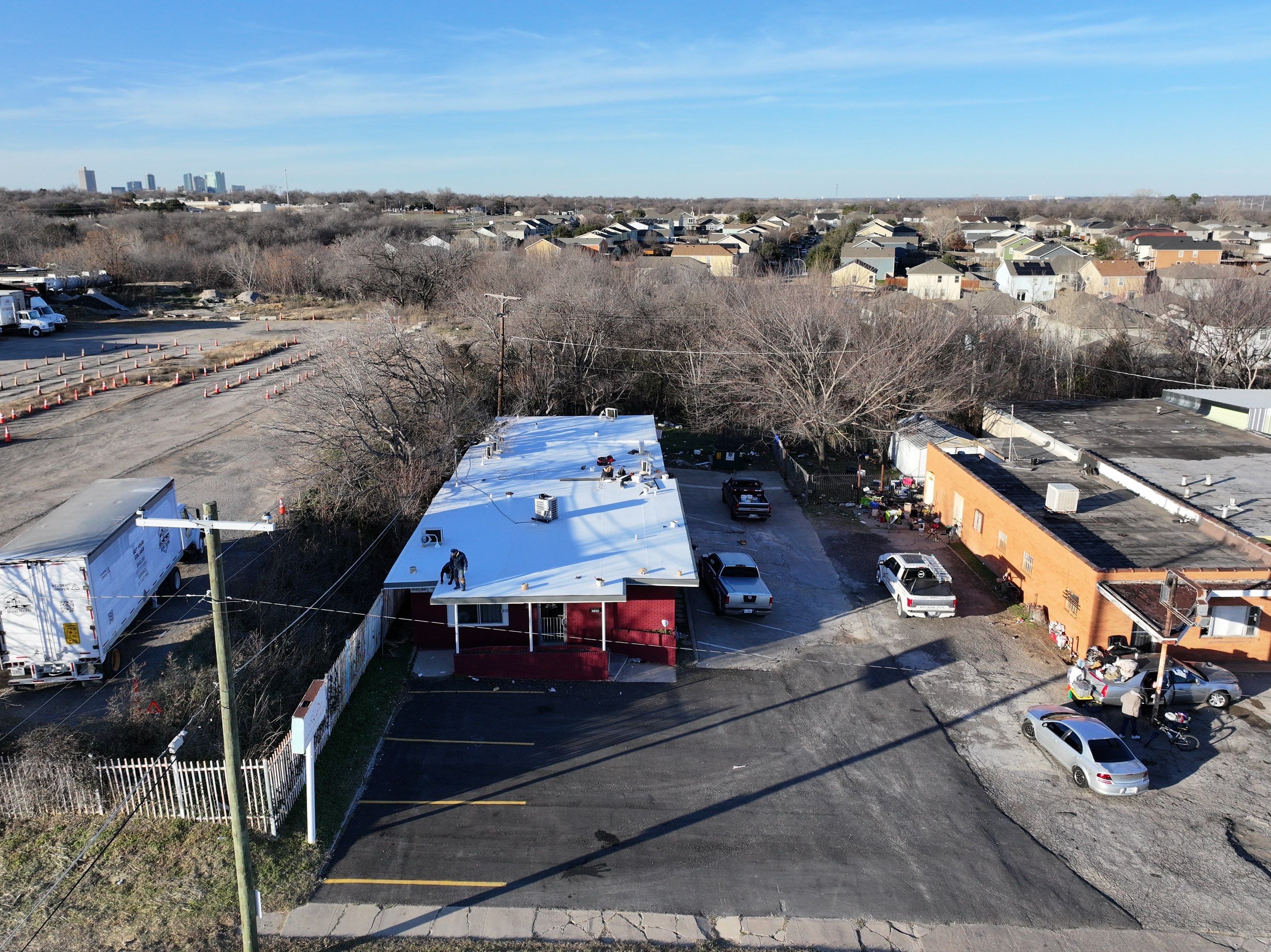 Commercial roofing overlay using GAF TPO over an old ballast roof by Becker Roofing and Exteriors