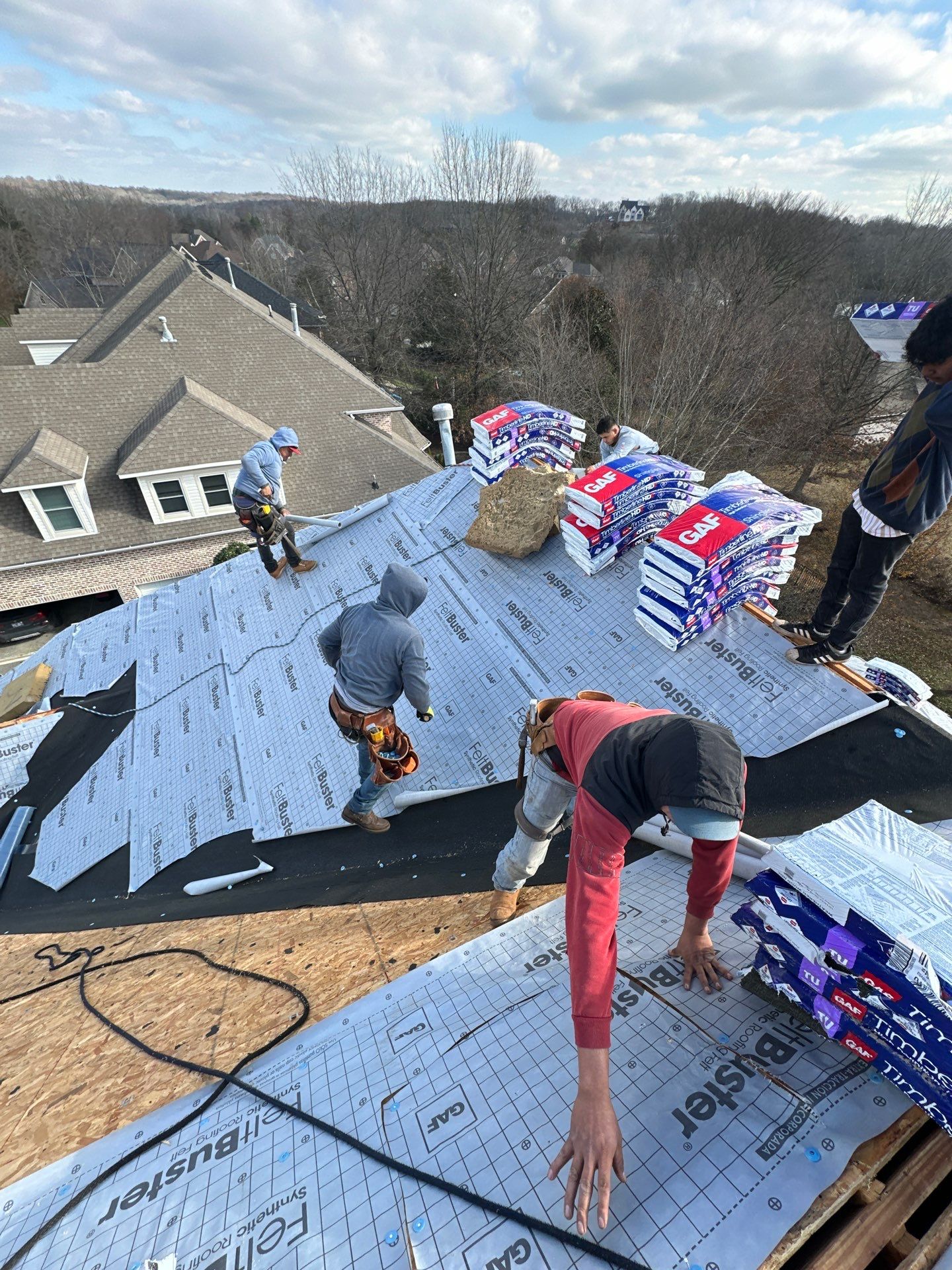 Residential Roofing Installation using GAF Timberline HDZ Weathered Wood Shingles by Undersun Roofing 