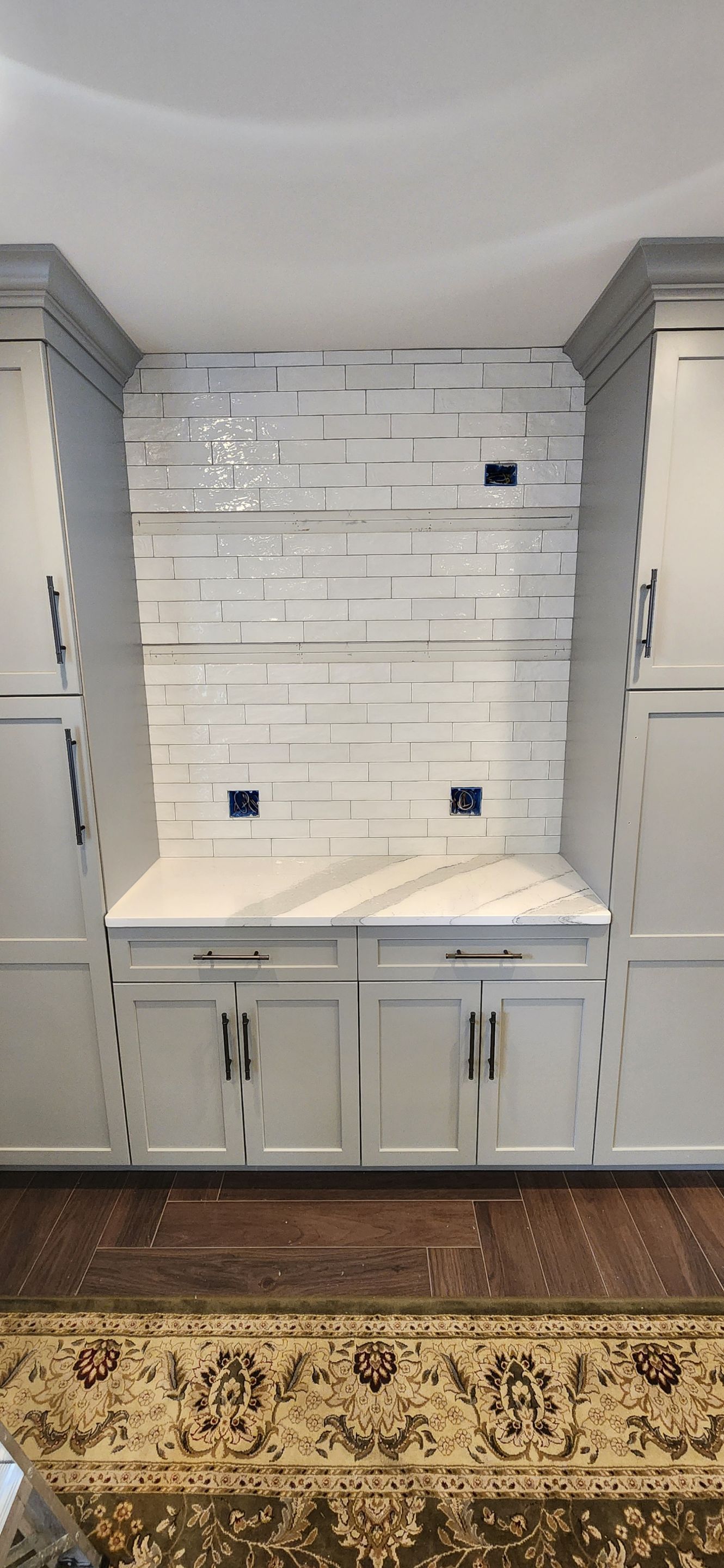 Herringbone Floor install w/ Subway Tile Backsplash by Footprints Floors Morristown