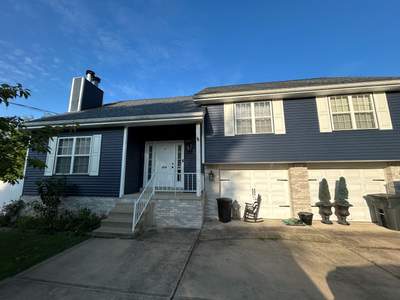 Vinyl Siding Renovation and Stone Veneer Upgrade in Carnegie