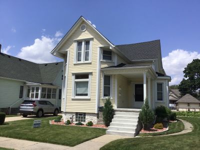 Rebuild balcony flat roofing TREX decking stairway and Railings in Wyandotte, MI