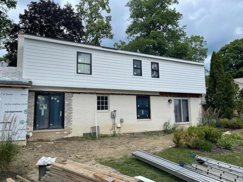 Siding Replacement using Hardie Plank S8 1/4"  Arctic White by 180 Contractors