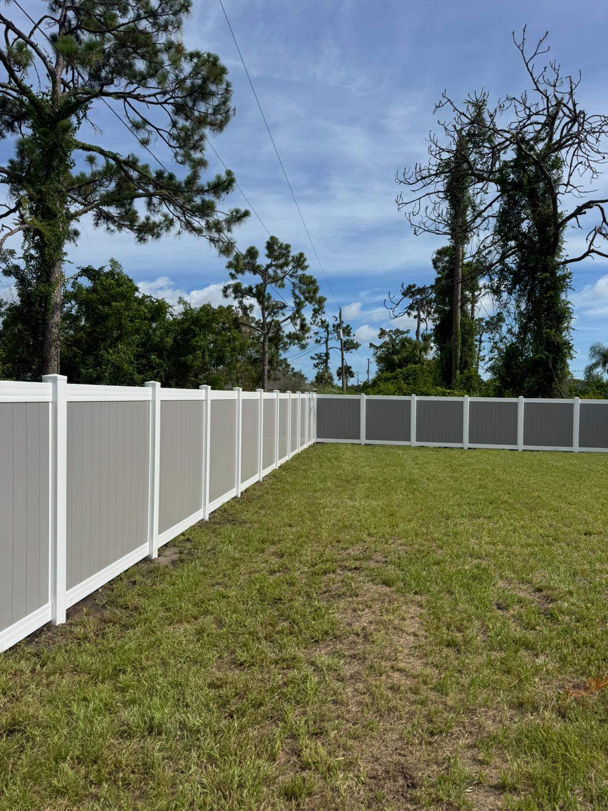 Two-Tone Vinyl Privacy Fence Installation in Port Charlotte by True Fence LLC