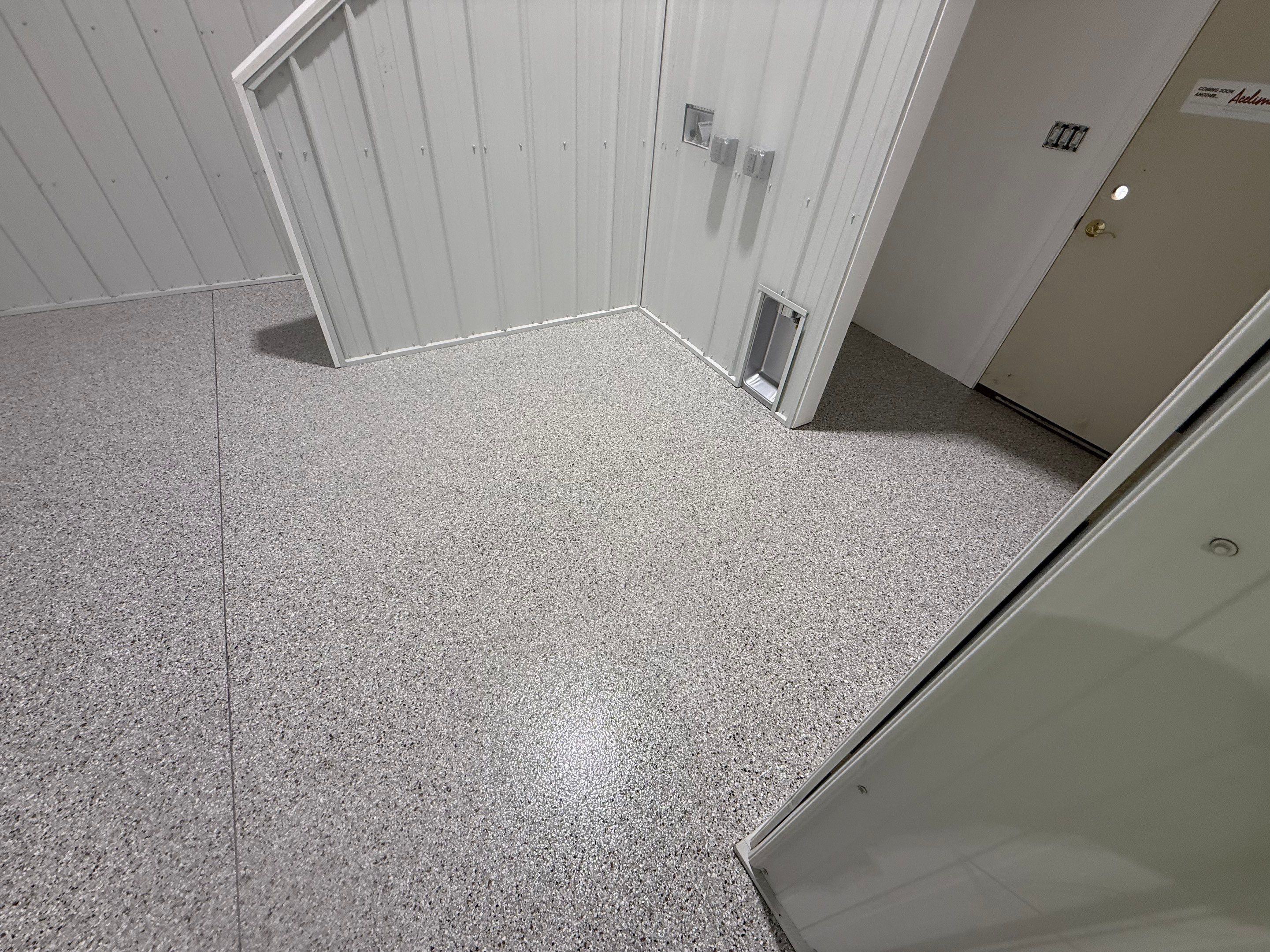 Custom Speckled Floor Coating for Large Montrose Shop by Select Painting, Coatings & Garage Cabinets
