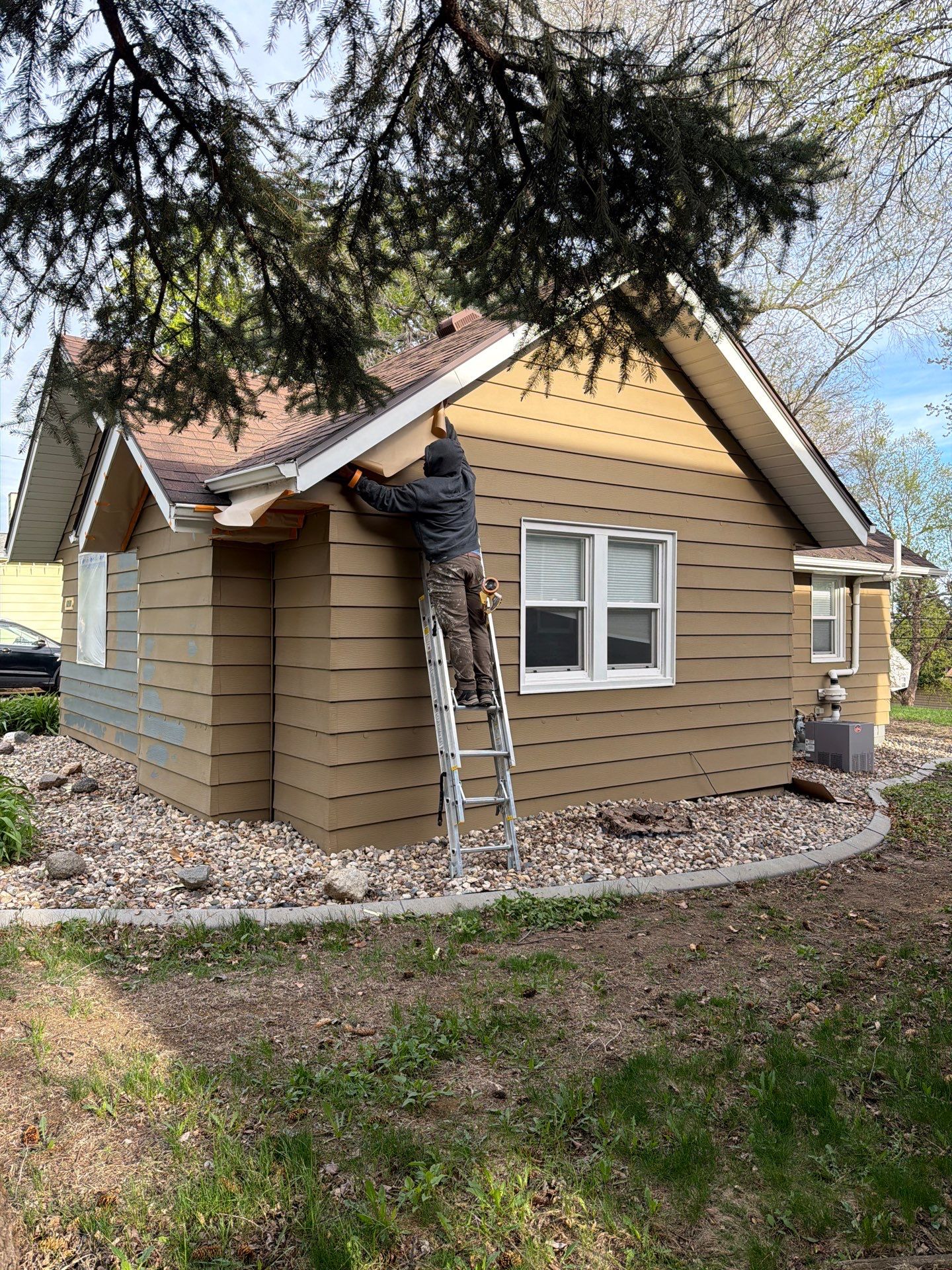 Exterior Siding Repair and Full House Repaint in Sioux Falls by Select Painting, Coatings & Garage Cabinets