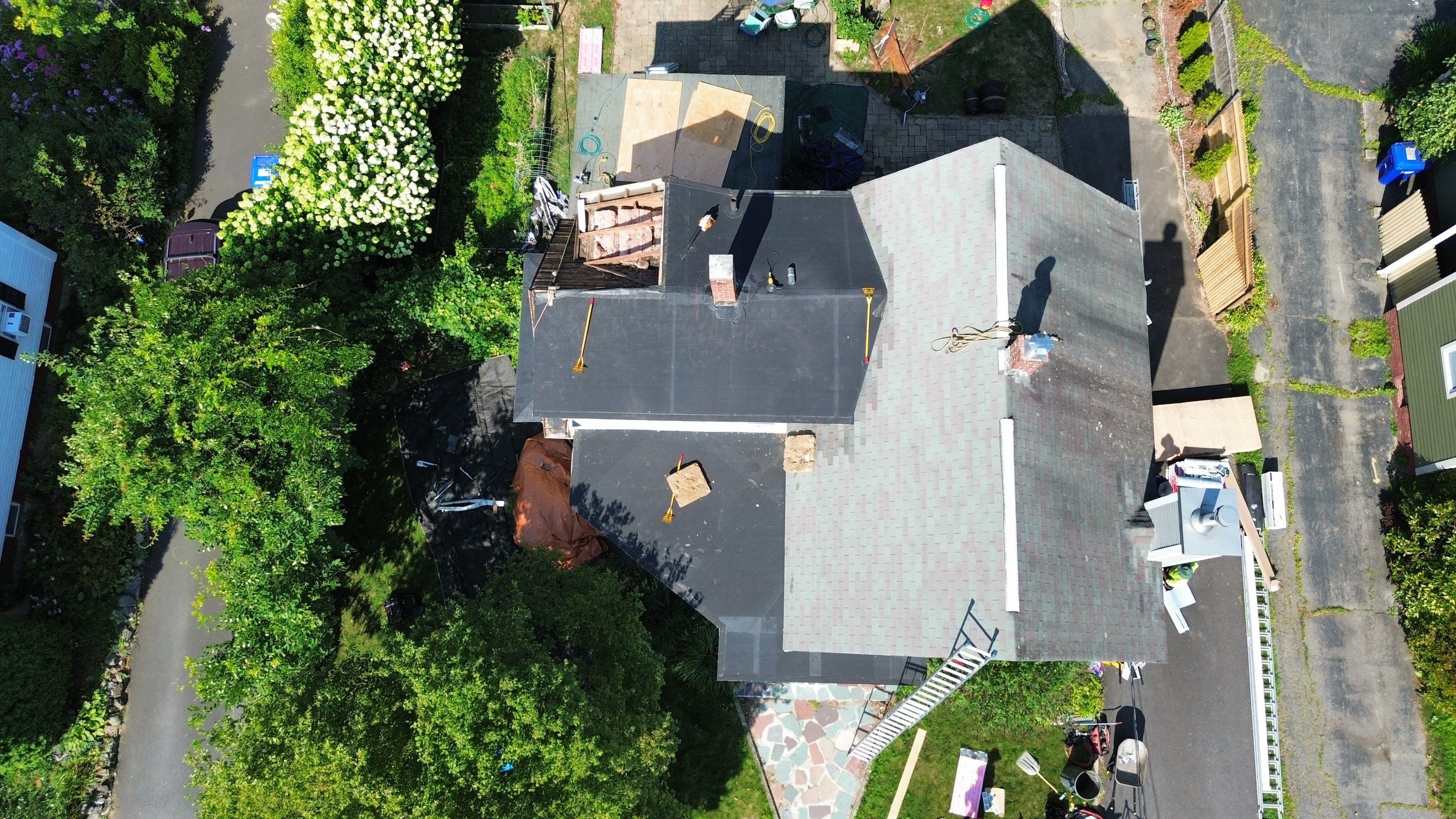 Full Roof Replacement + Custom Gutter Install | Onyx Black Finish by Mighty Dog Roofing of Greater Middlesex County