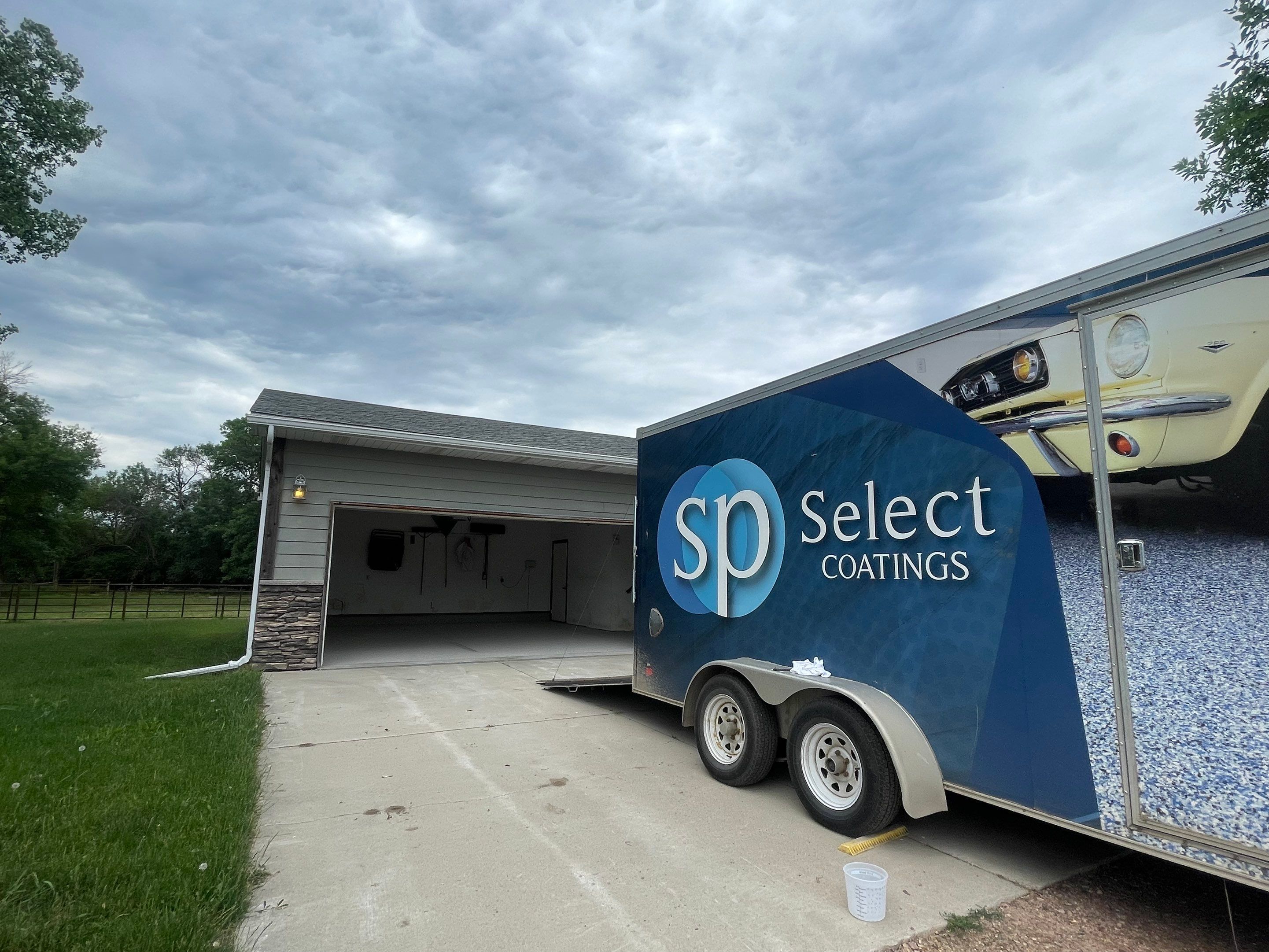 Hartford Residential Garage Floor Transformation With Decorative Chip Coating by Select Painting, Coatings & Garage Cabinets