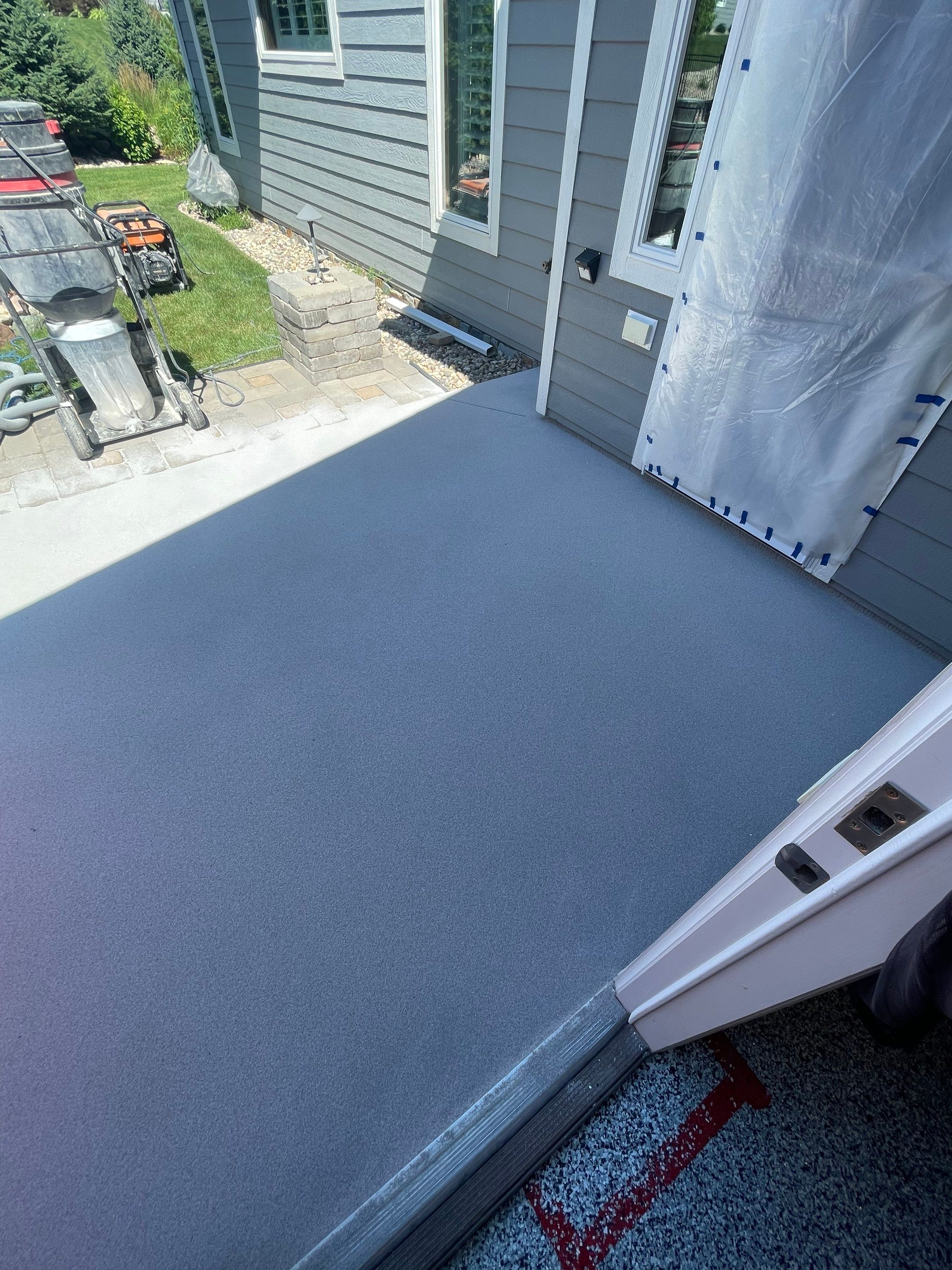 Concrete Patio Coating with Fuzzy Wool Finish in Sioux Falls by Select Painting, Coatings & Garage Cabinets