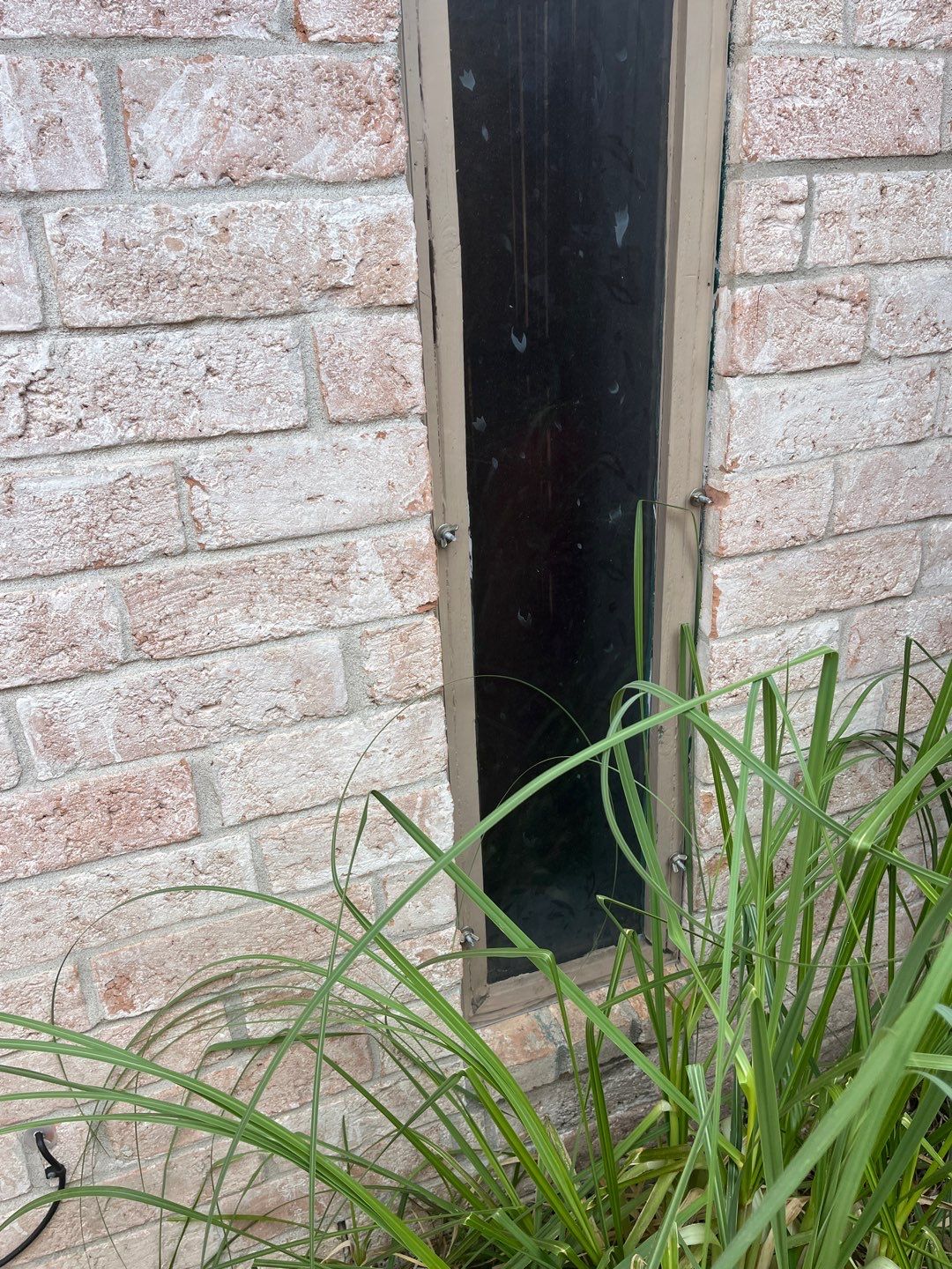 Colored Vinyl Windows to blend into brick by Bayfront Roofing and Construction