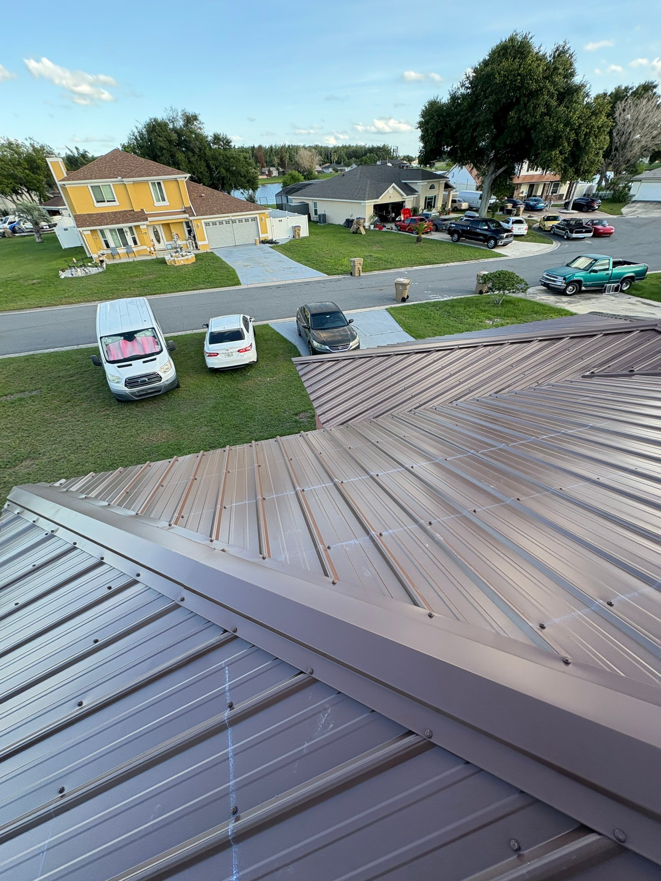 Residential Metal Roofing Installation and Gutter Replacement in Kissimmee by Pinnacle Roofing Group