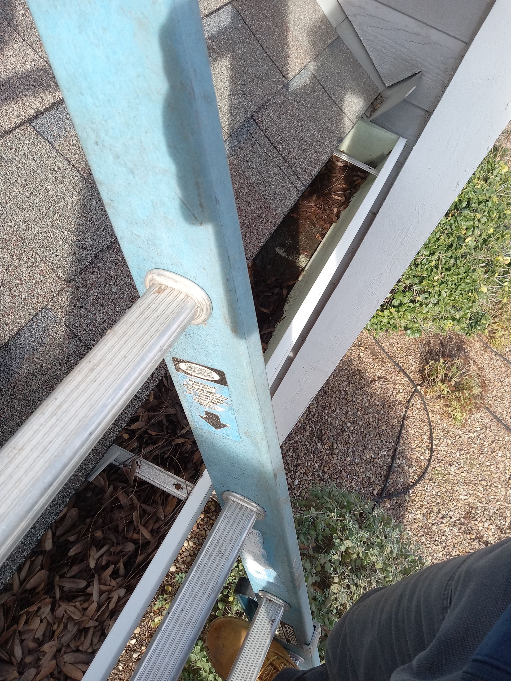 Commercial gutter cleaning Wichita before photo with filled gutters