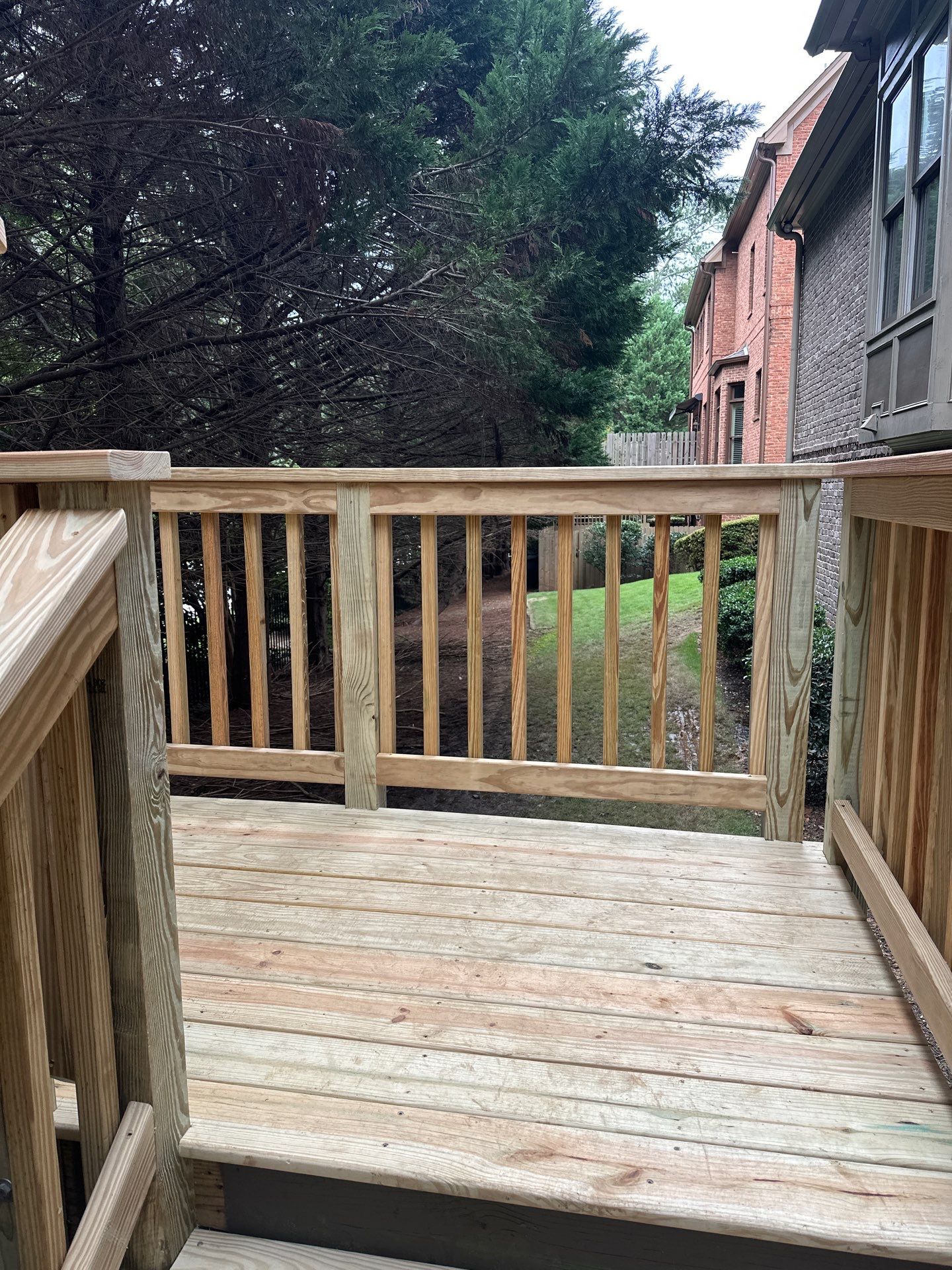 Decatur, GA Deck Resurface and Privacy Wall Build Using Pressure Treated Pine by Nelson Exteriors 