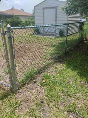 Green Vinyl-Coated Chain Link Fence Installation in North Port