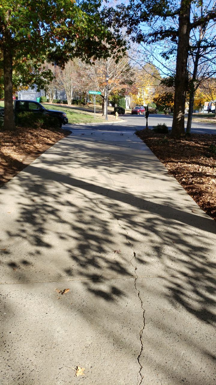 Driveway Clean using cleaner by Power Wash Masters LLC