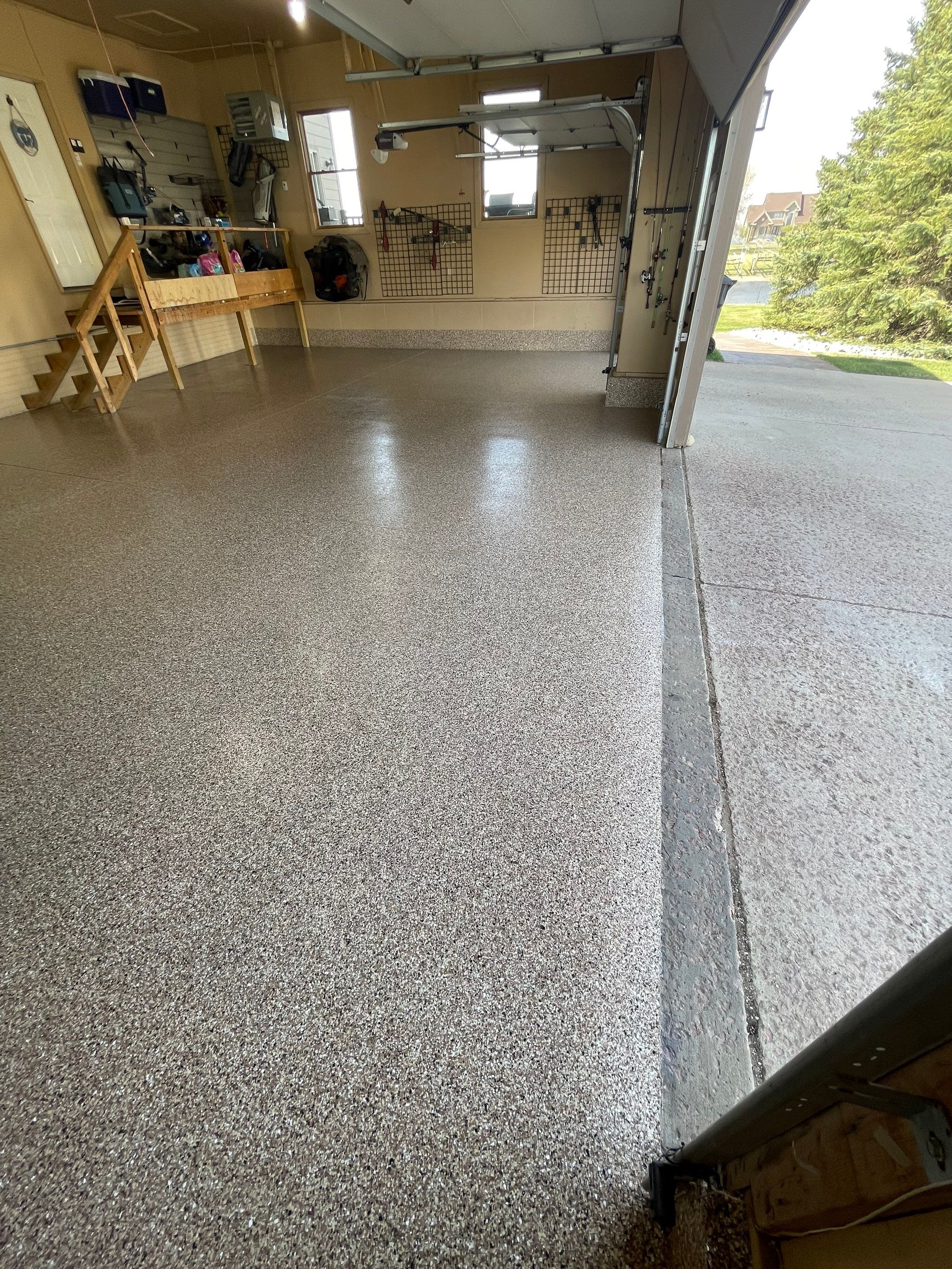 Residential Garage Floor Transformation with Speckled Epoxy Coating by Select Painting, Coatings & Garage Cabinets