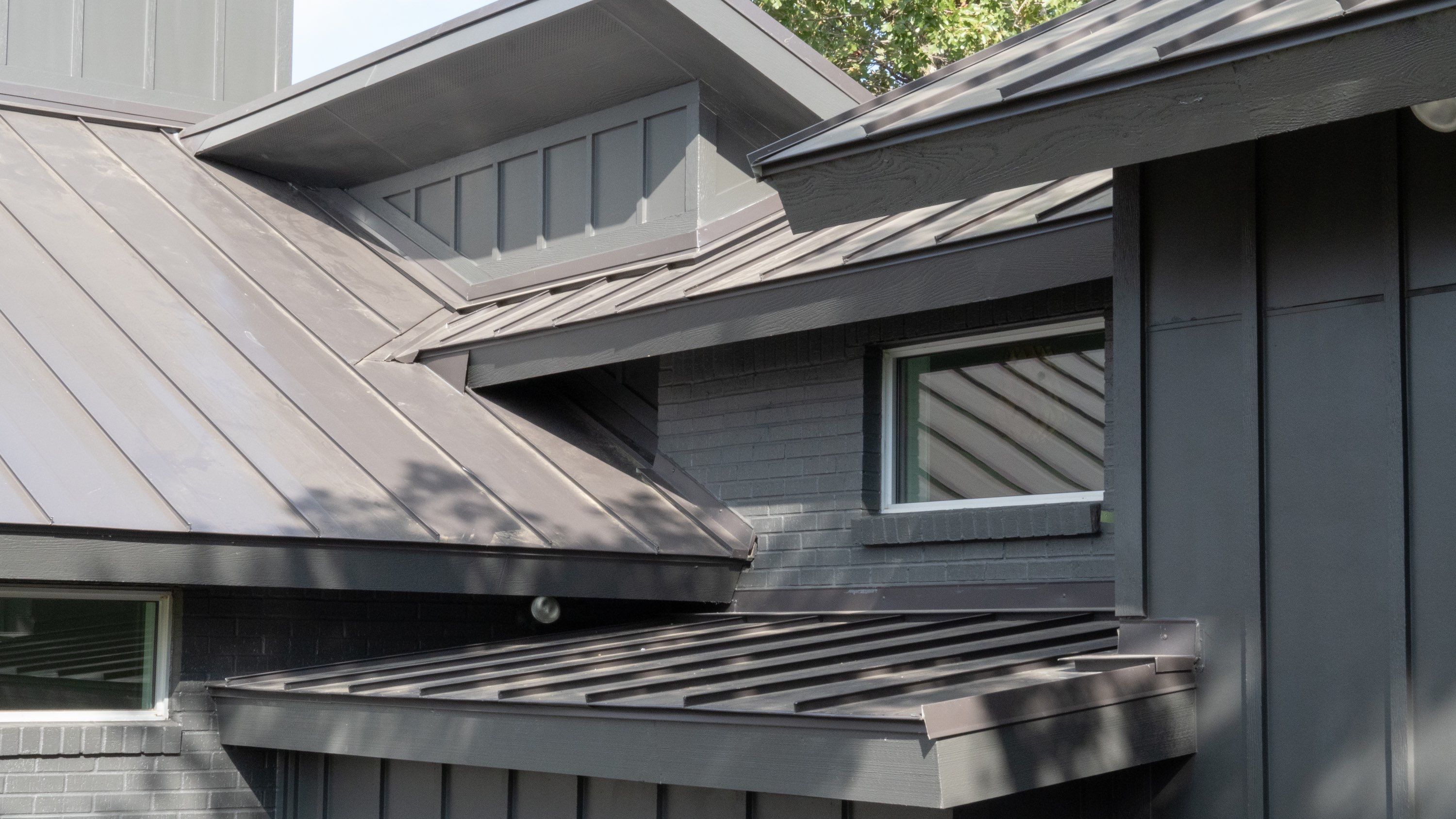 Dark Bronze Standing Seam Metal Roof by First Out Roofing 